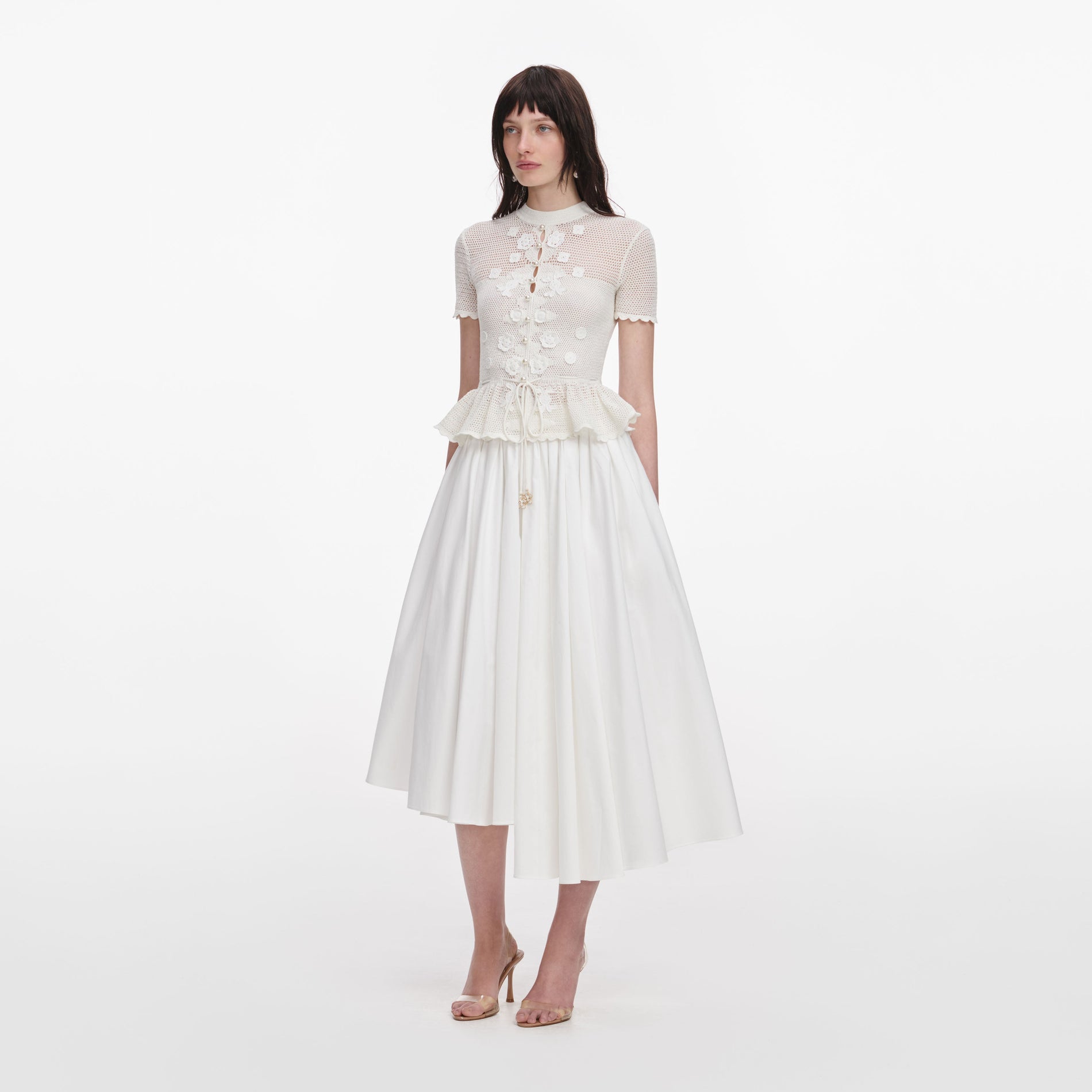 Side view of a woman wearing the White Floral Crochet Top