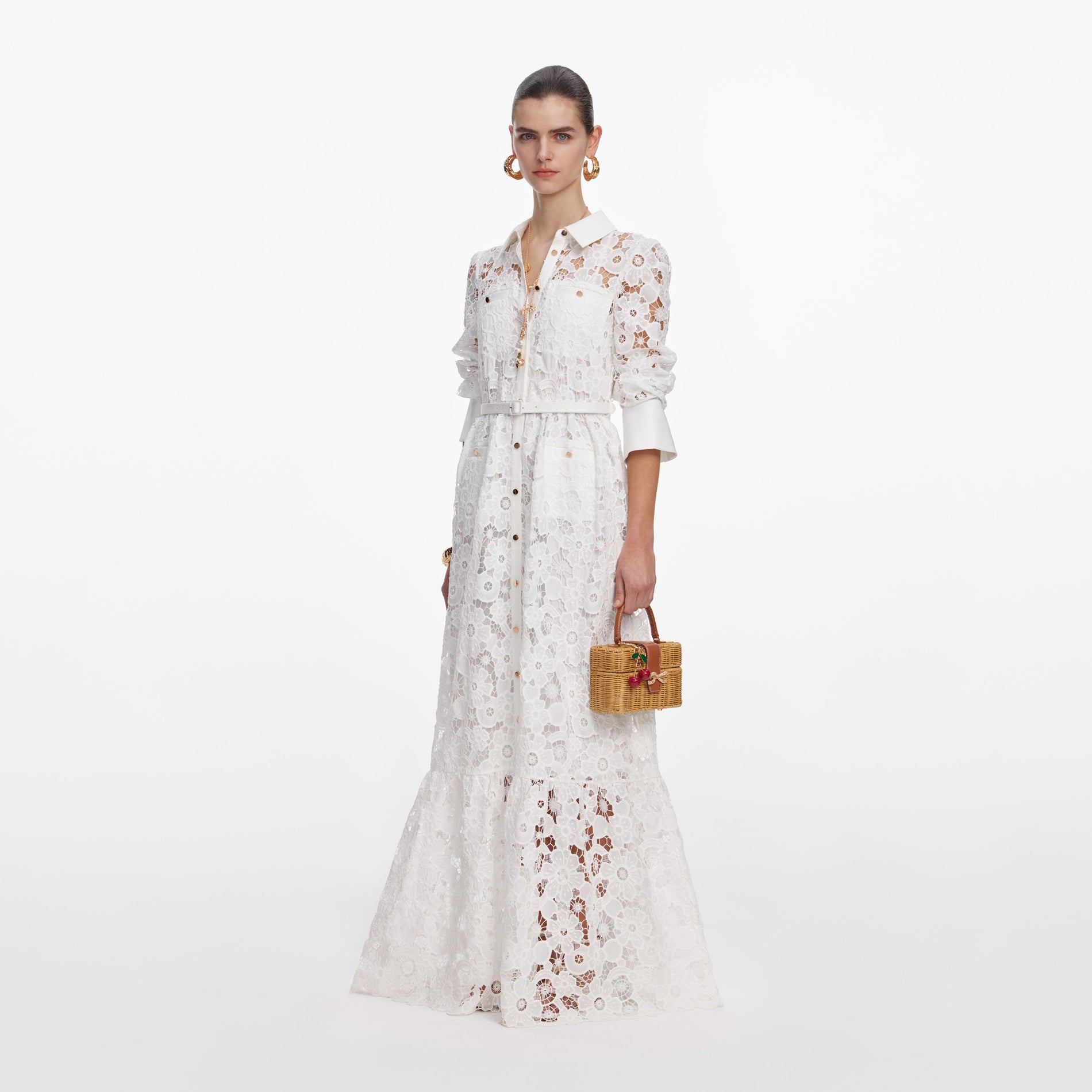 Side view of a woman wearing the White Lace Collared Maxi Dress