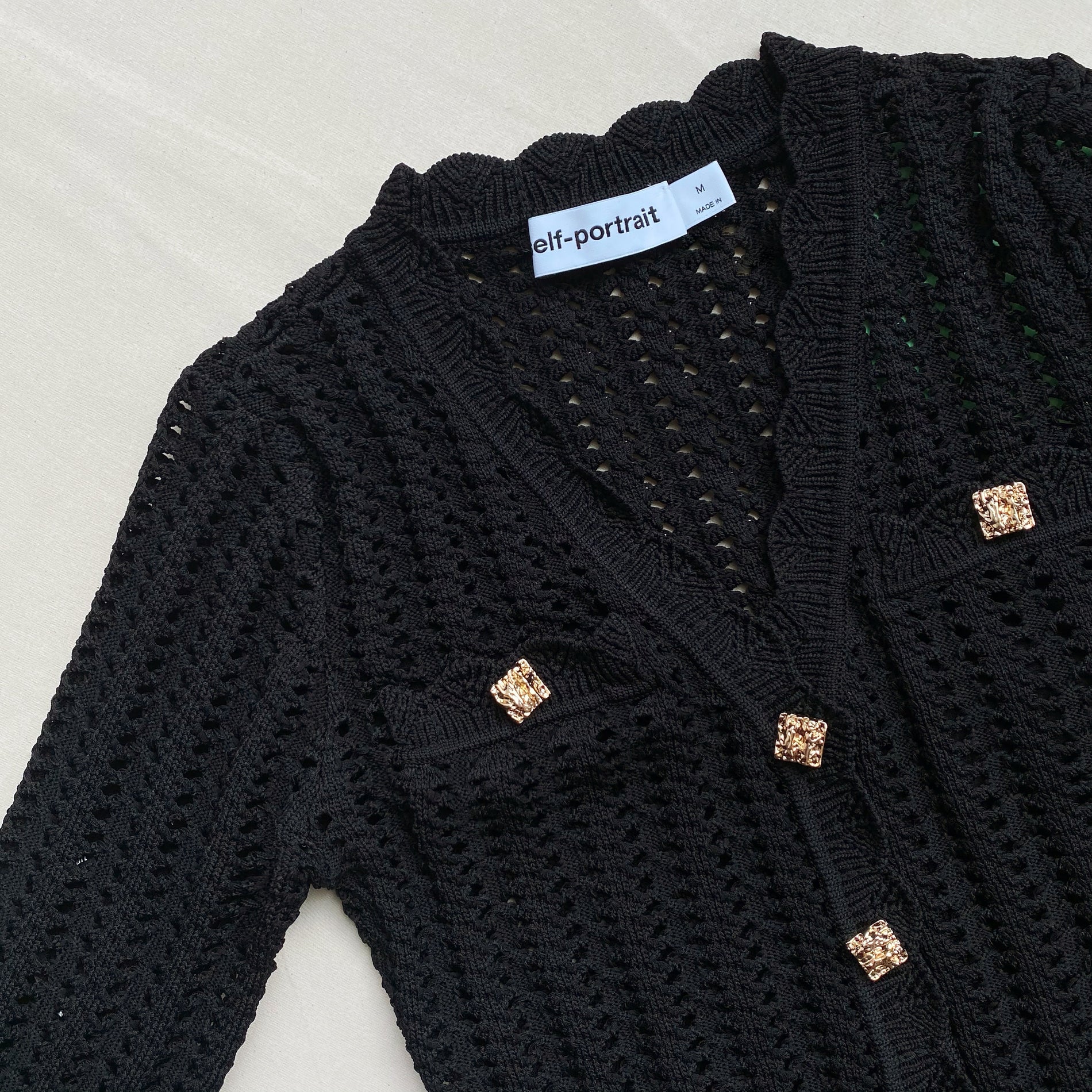 A close up of the fabric for the Black Crochet Knit Dress