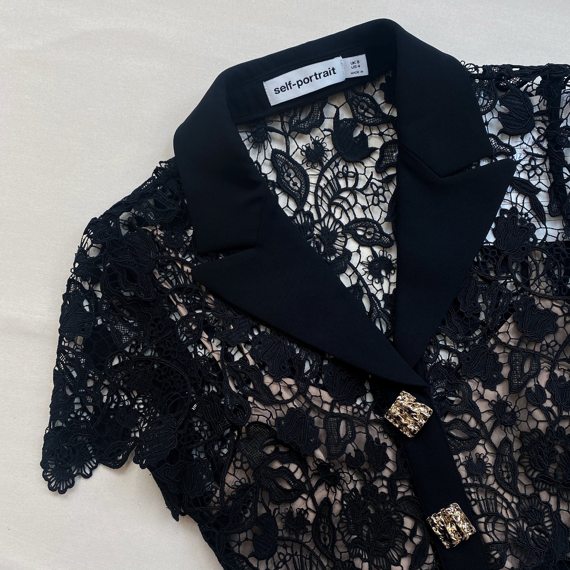 A close up of the fabric for the Black Magnolia Lace Midi Dress