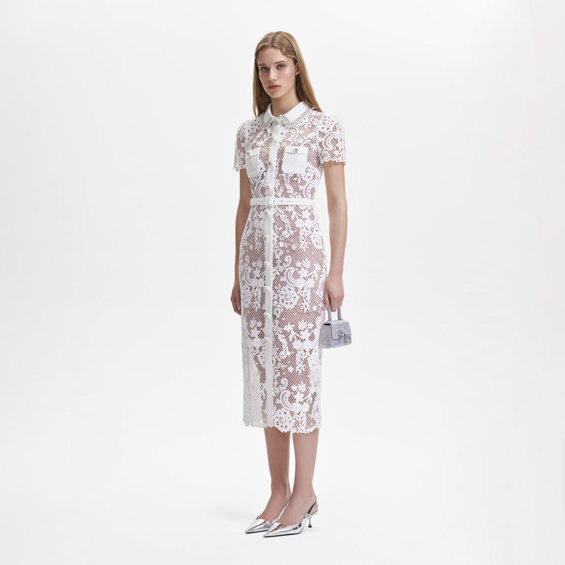 A woman wearing the White Lace Button Front Midi Dress