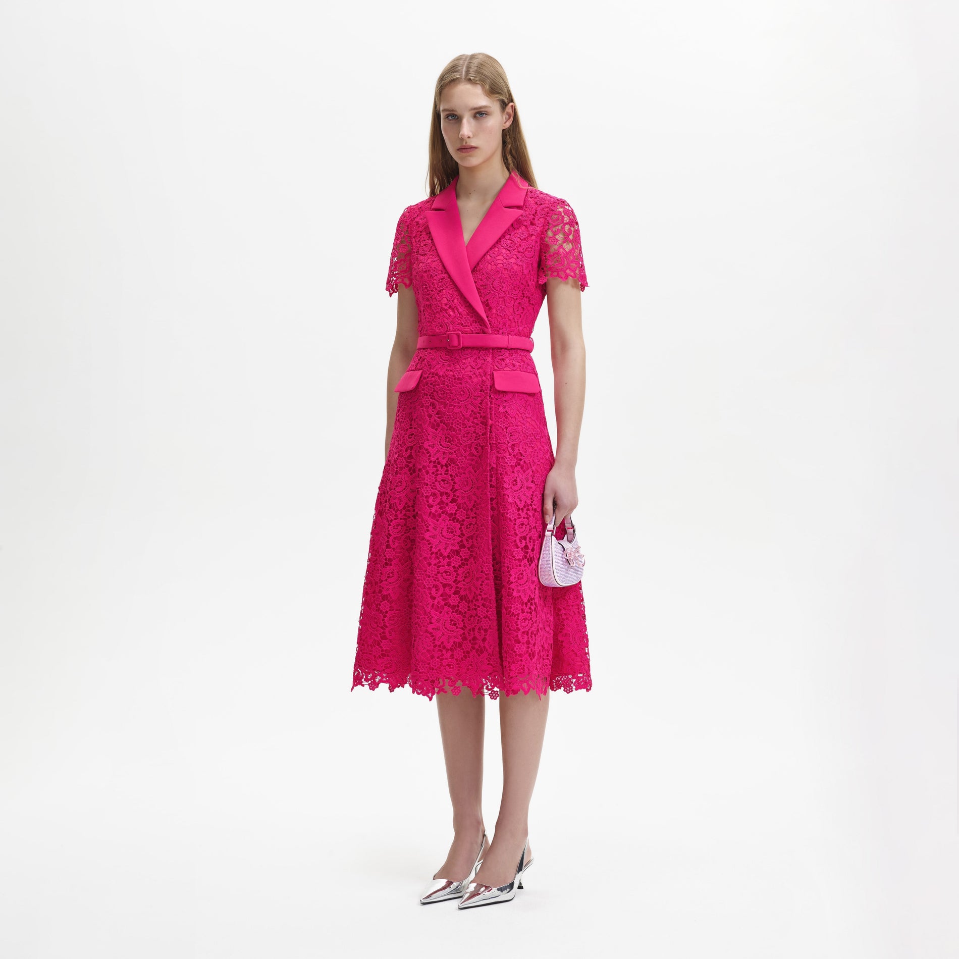 A woman wearing the Magenta Lace Midi Dress