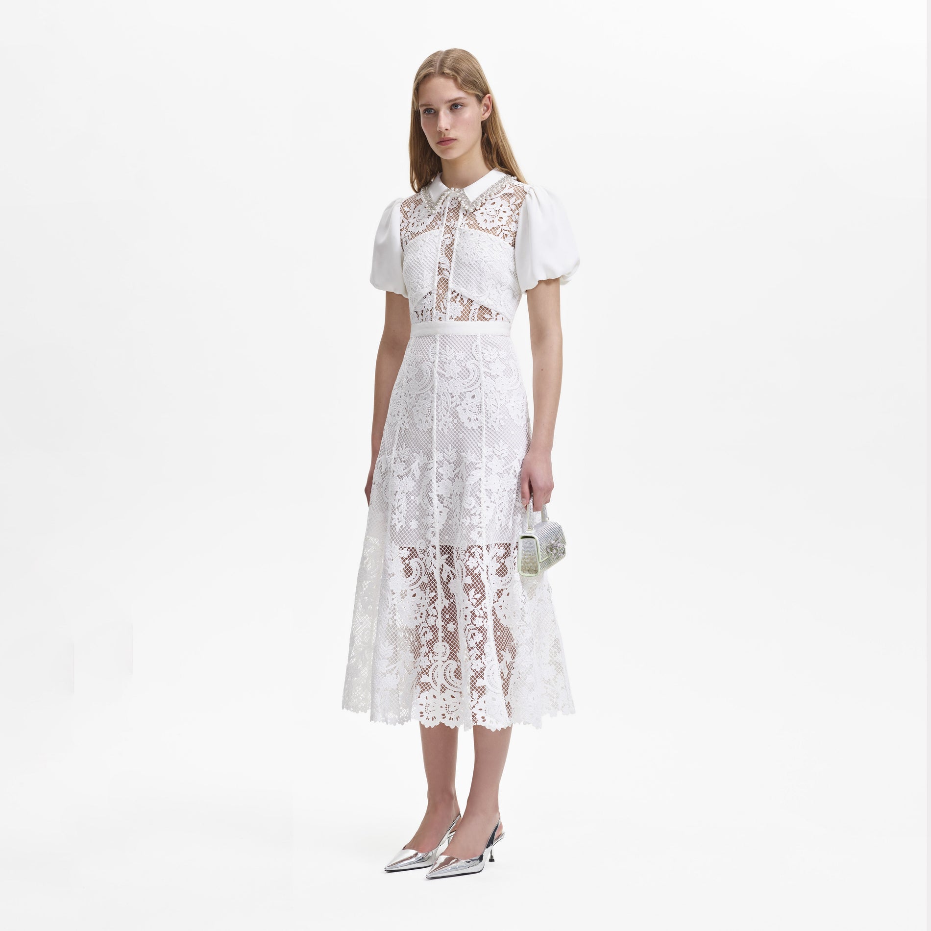A woman wearing the White Lace Diamante Collar Midi Dress