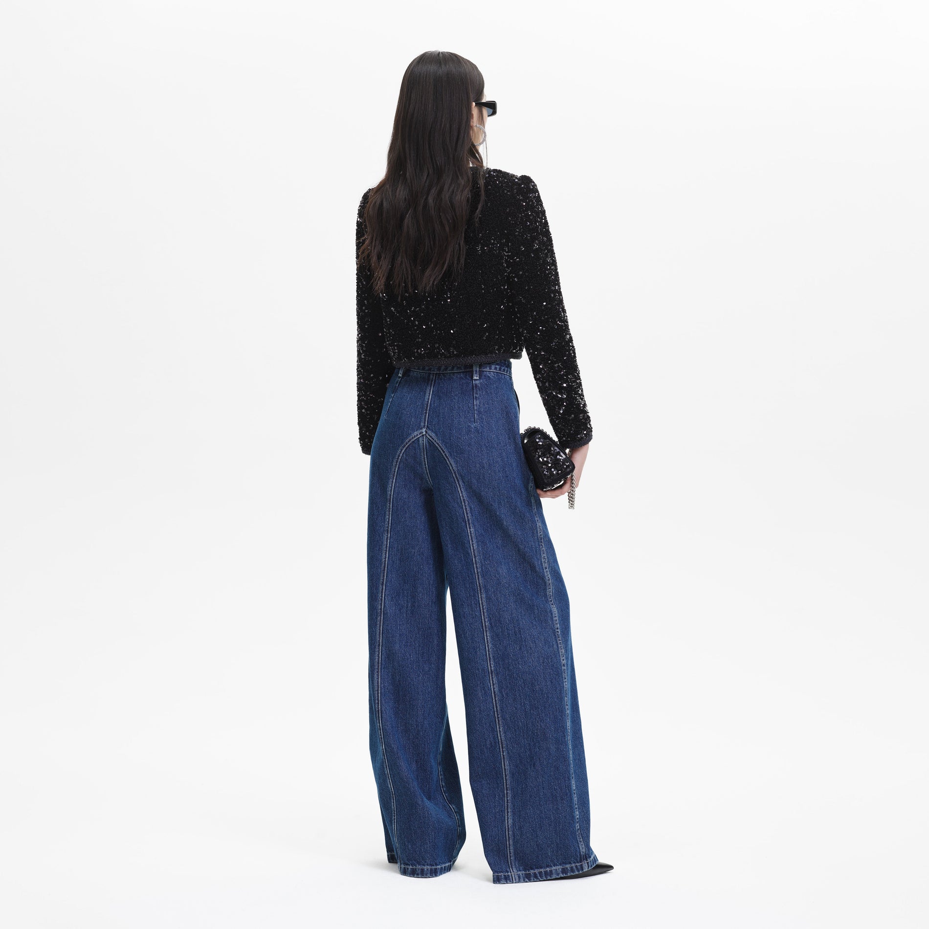 Back view of a woman wearing the Black Sequin Cropped Jacket