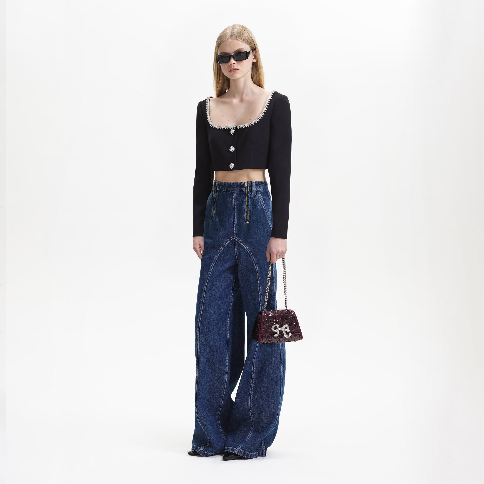 A woman wearing the Blue Wide Leg Stitch Detail Jeans
