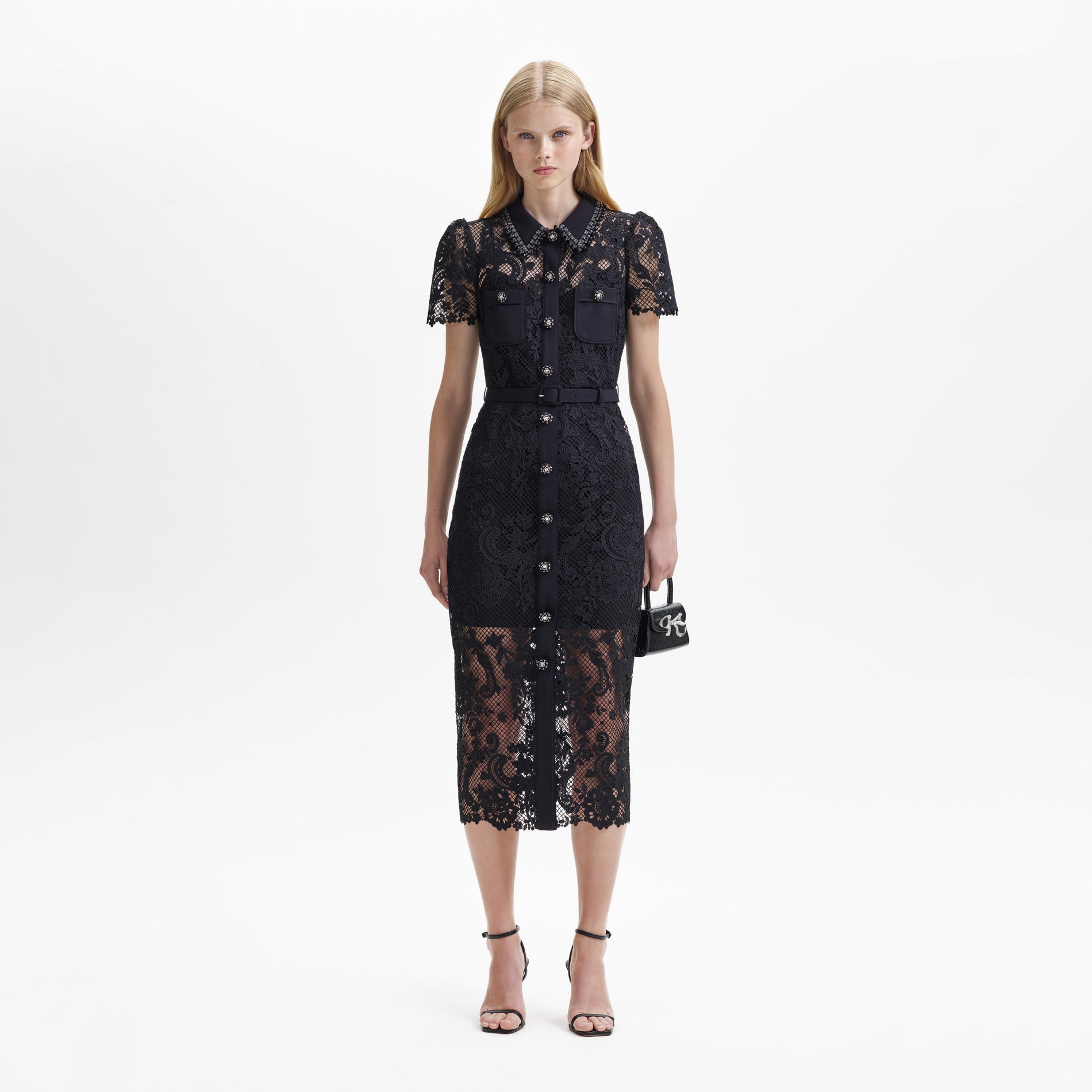 A woman wearing the Black Lace Button Front Midi Dress