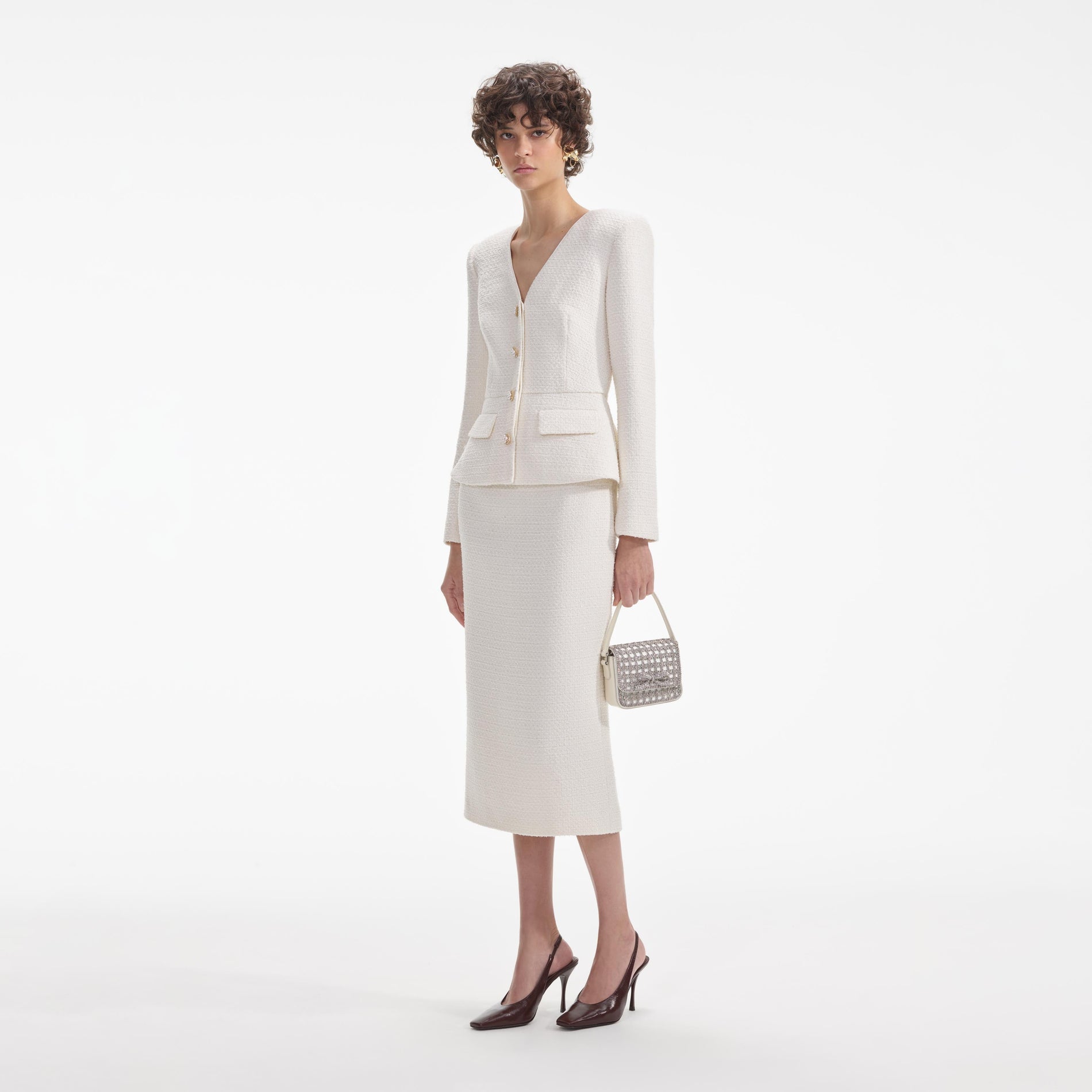 Side view of a woman wearing the Cream Tinsel Boucle Midi Dress