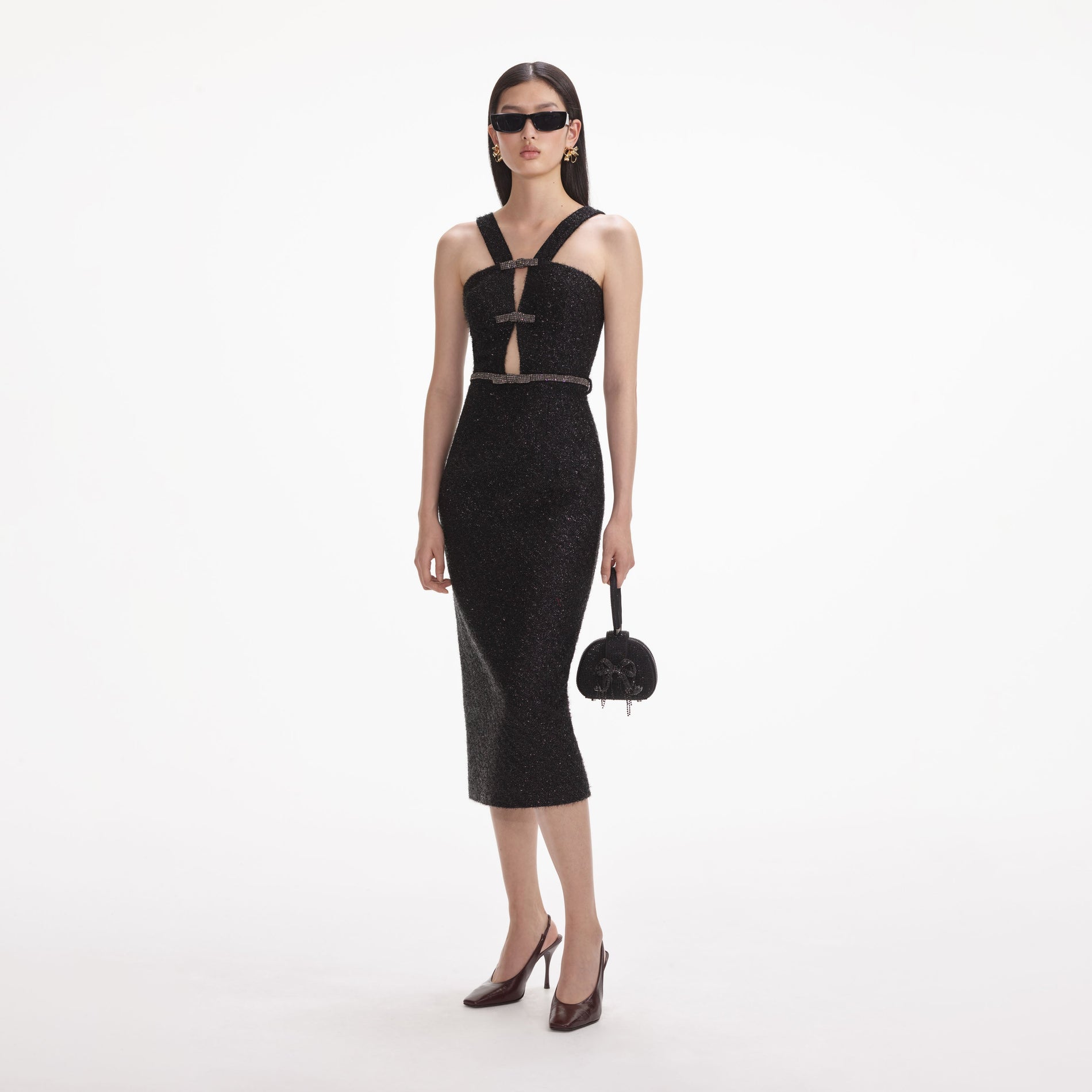 Side view of a woman wearing the Black Tinsel Boucle Midi Dress