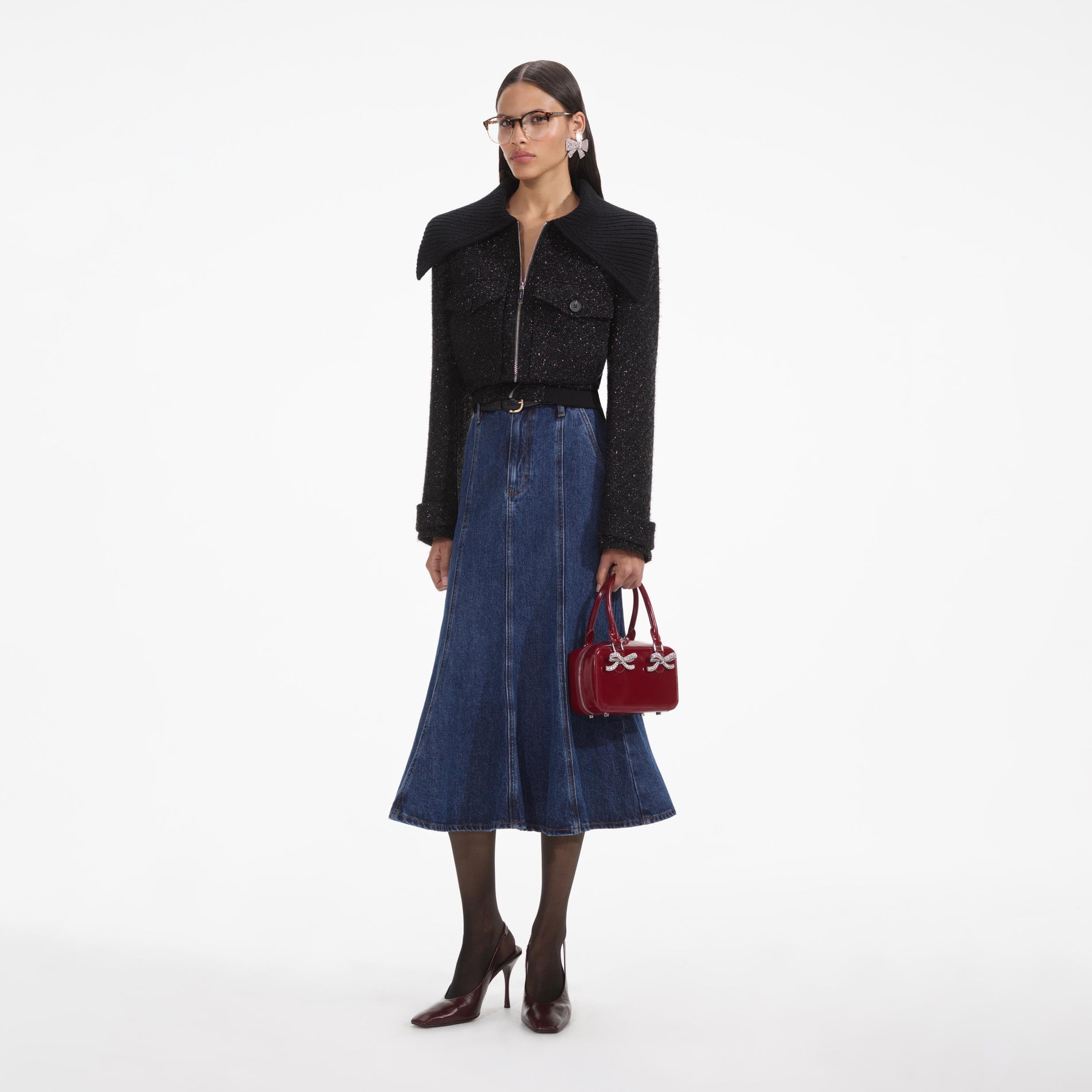 Side view of a woman wearing the Black Tinsel Boucle Bomber Jacket