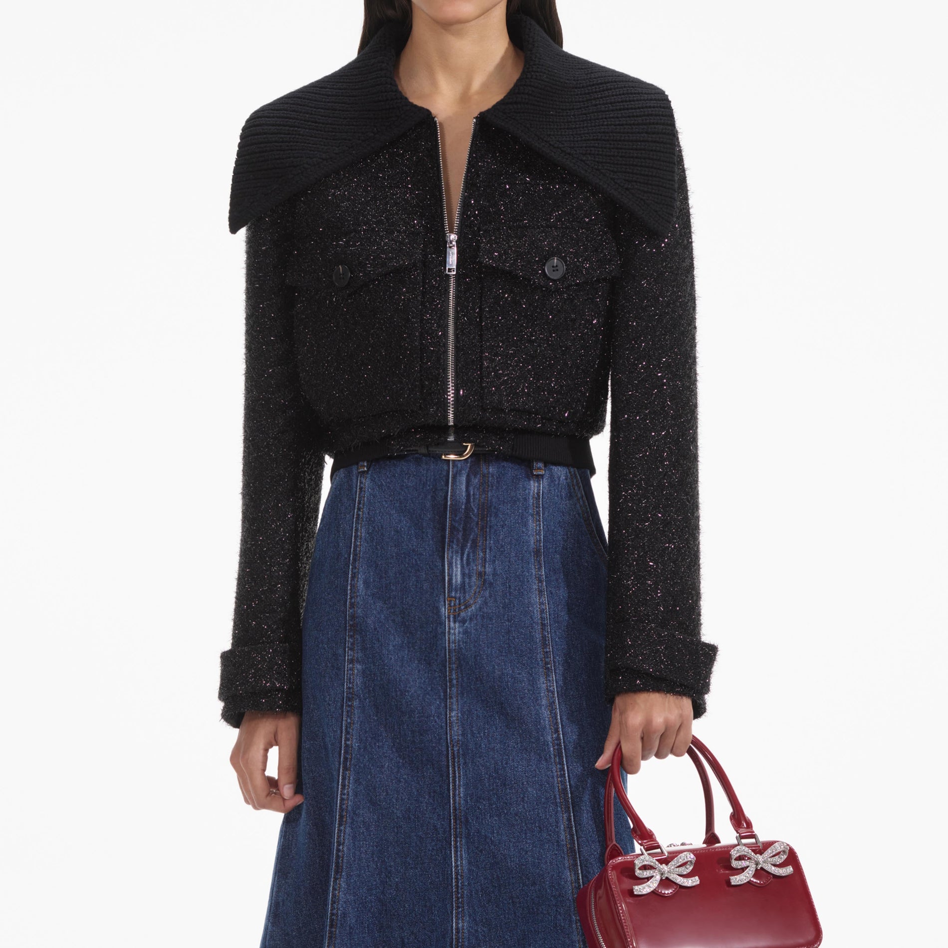 A close up of a woman wearing the Black Tinsel Boucle Bomber Jacket