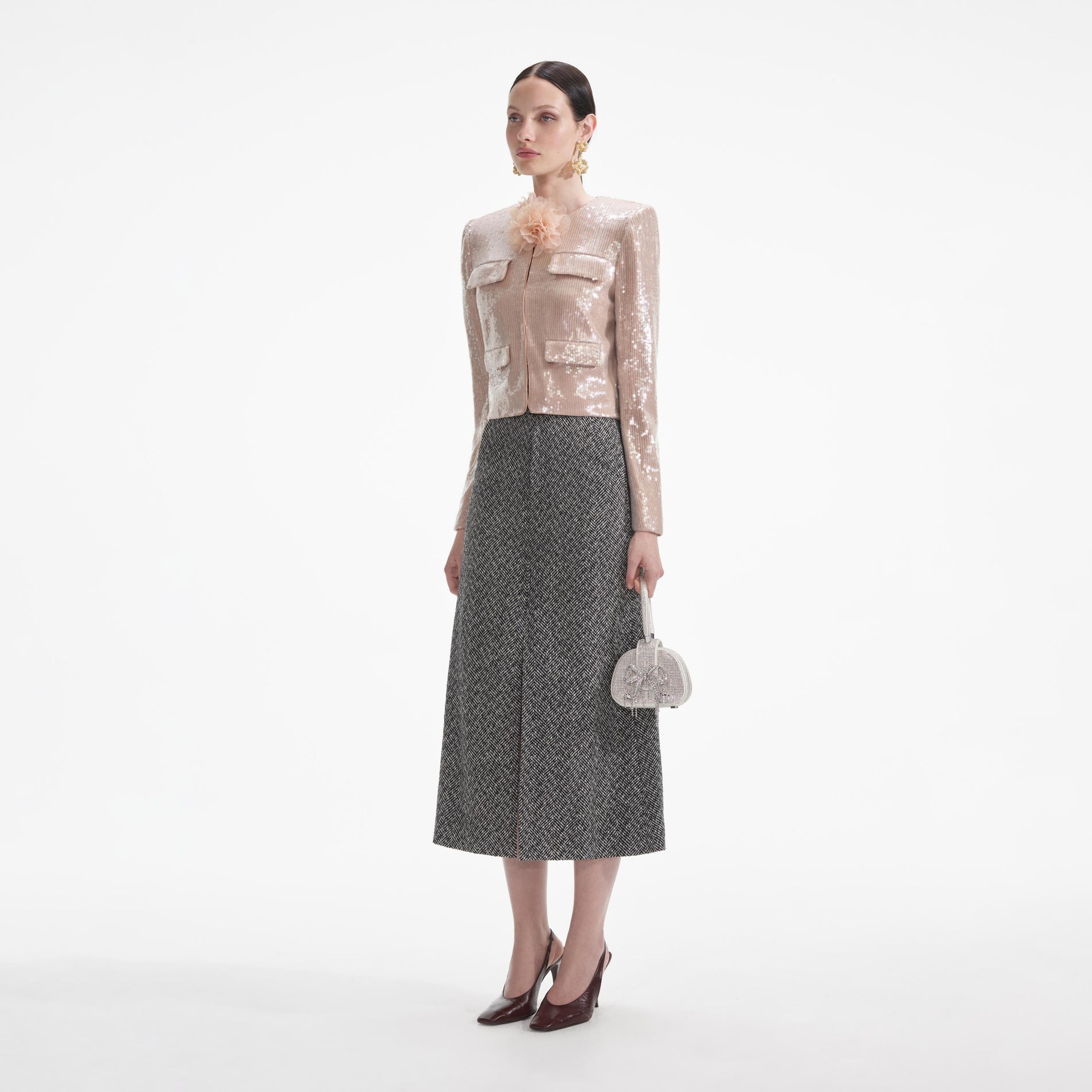 Side view of a woman wearing the Champagne Sequin Jacket