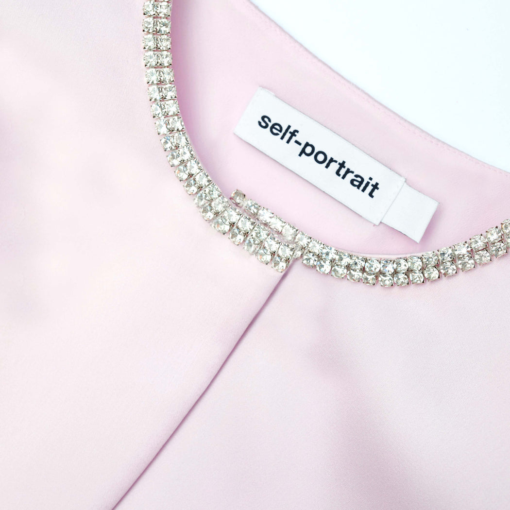 A close up of the fabric for the Pink Satin Bolero Jacket