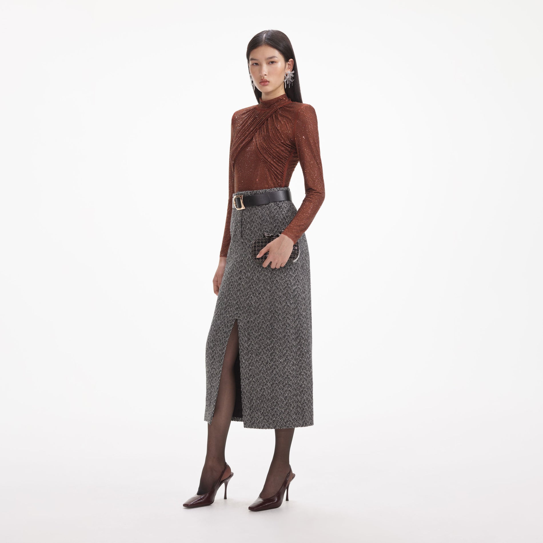 Side view of a woman wearing the Brown Rhinestone Mesh Top