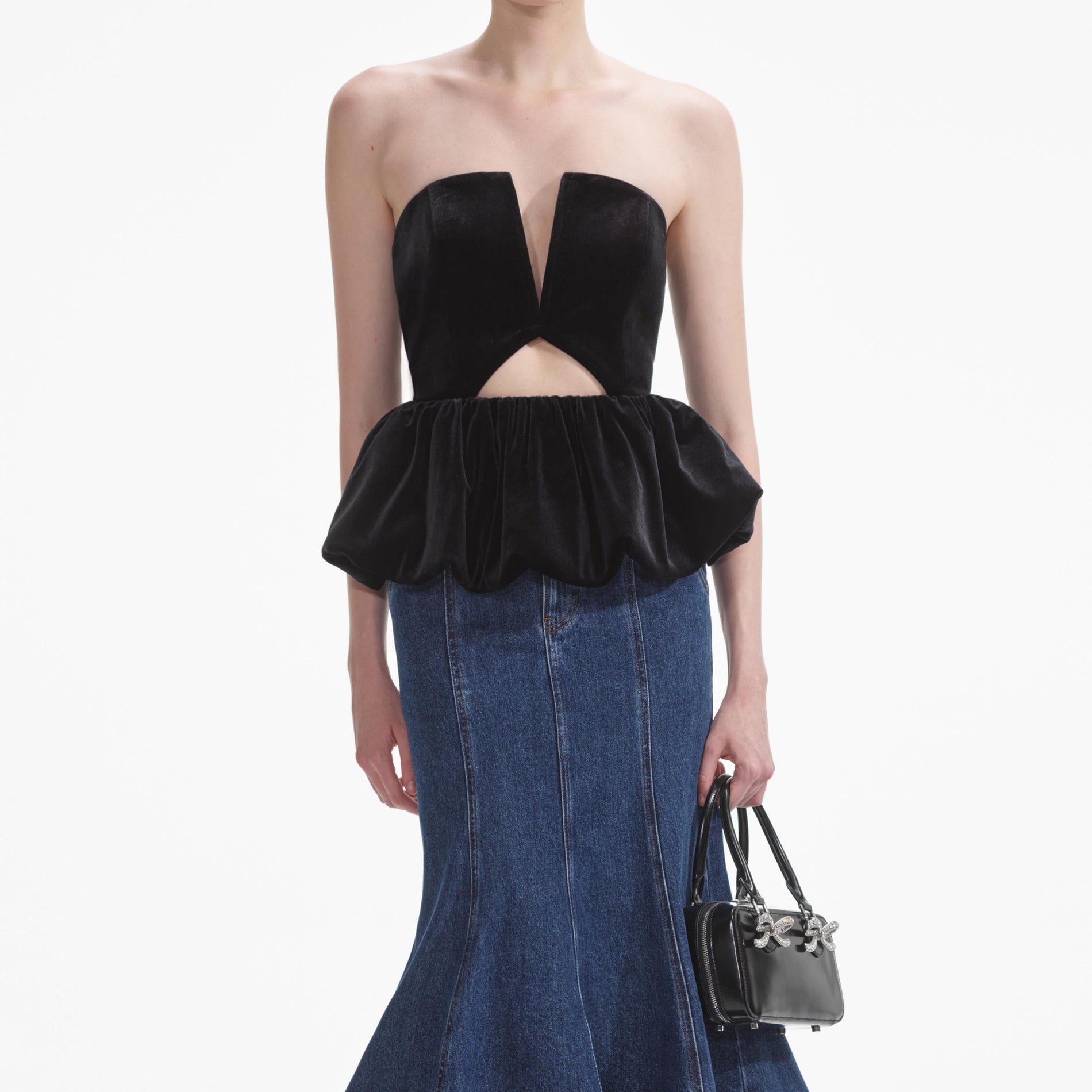 A close up of a woman wearing the Black Velvet Bandeau Top