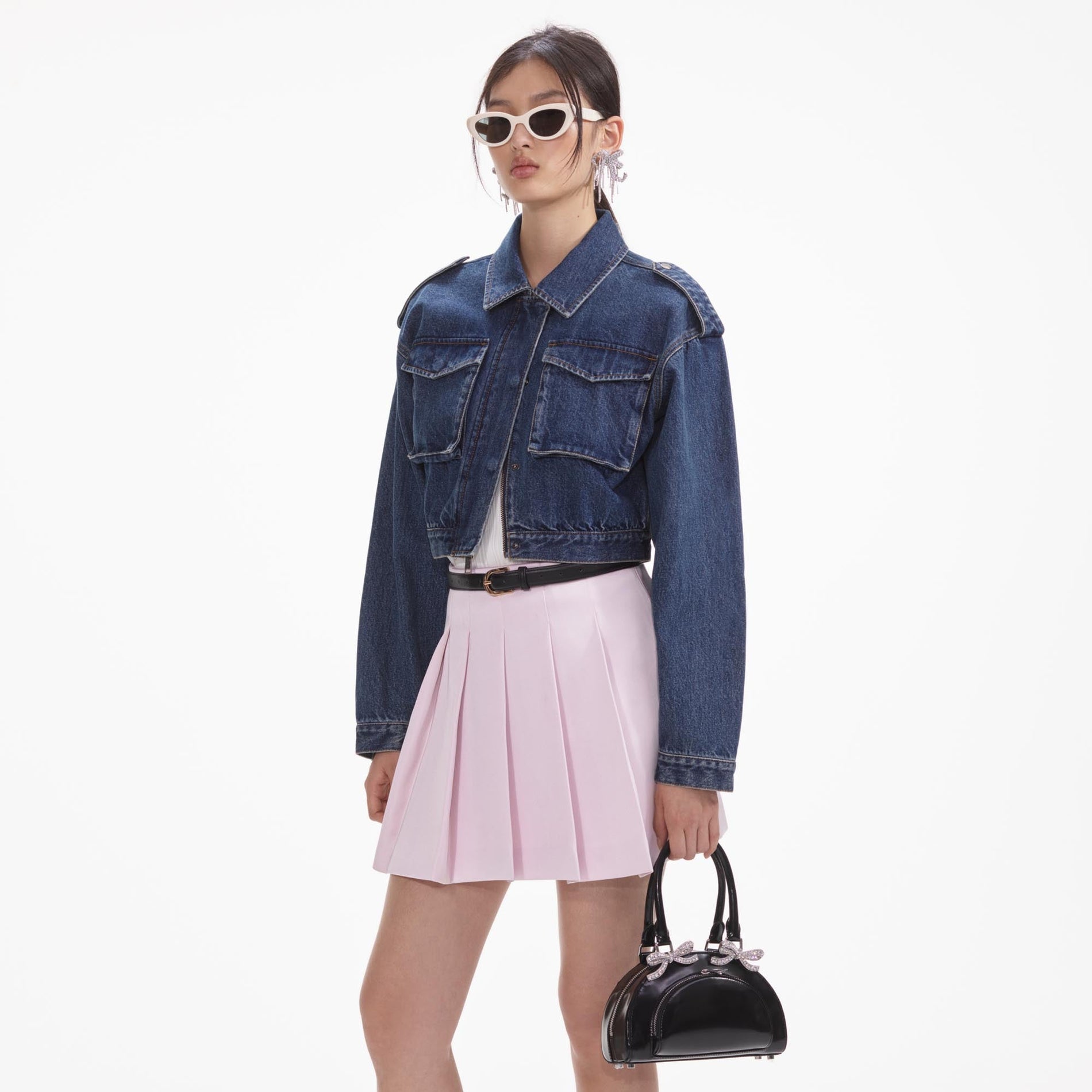 A close up of the fabric for the Black Leather Curved Mini Tote Bag