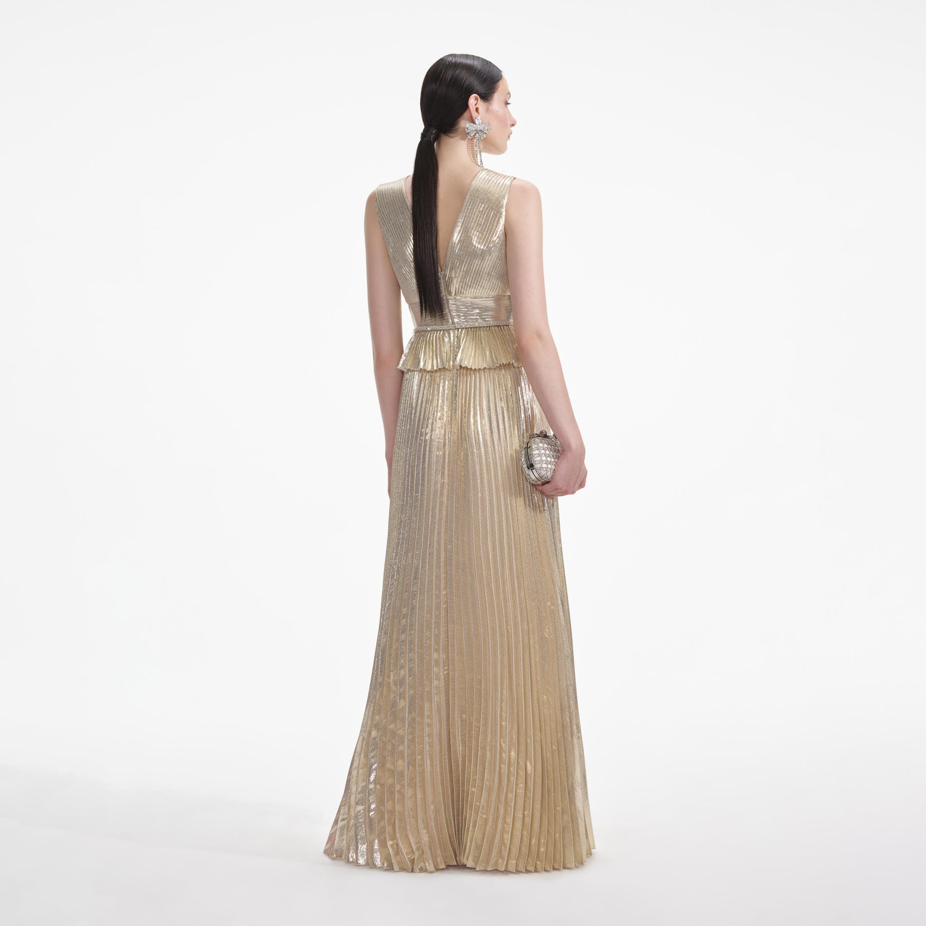 Back view of a woman wearing the White Gold Metallic V-Neck Maxi Dress