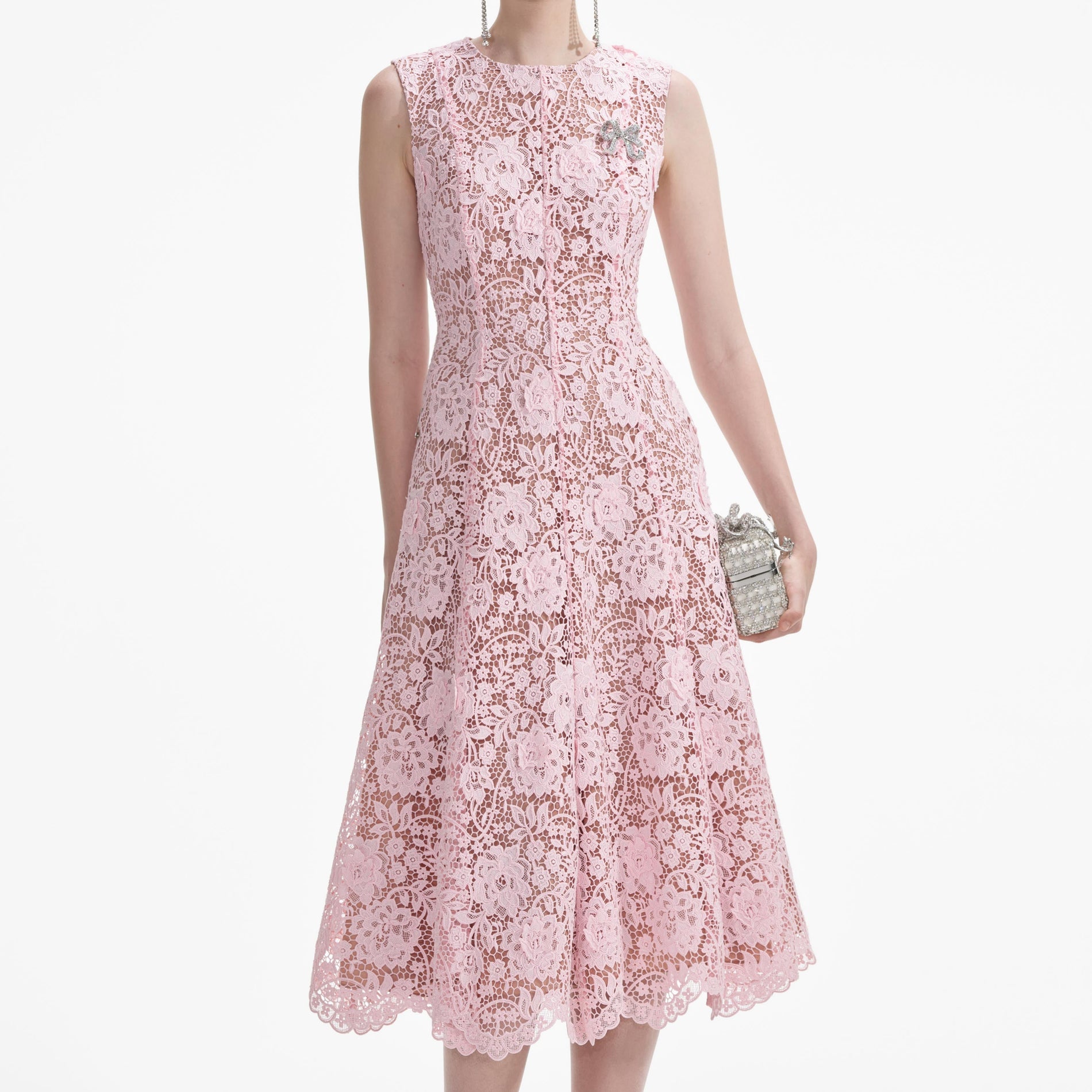 A close up of a woman wearing the Pink Flower Lace Midi Dress