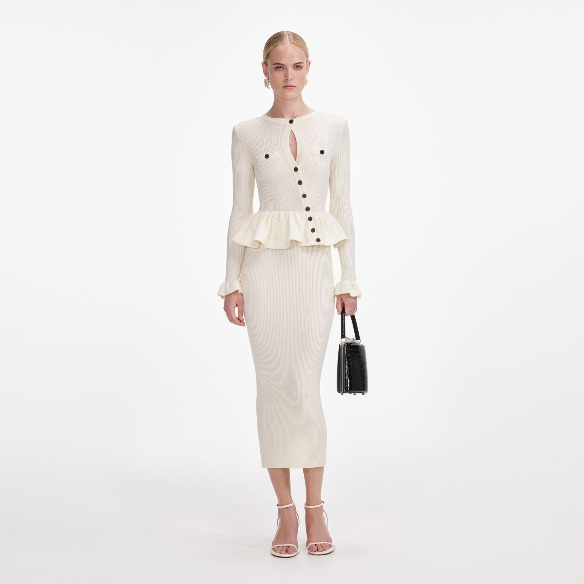 Front view of a woman wearing the Cream Asymmetric Knit Midi Dress