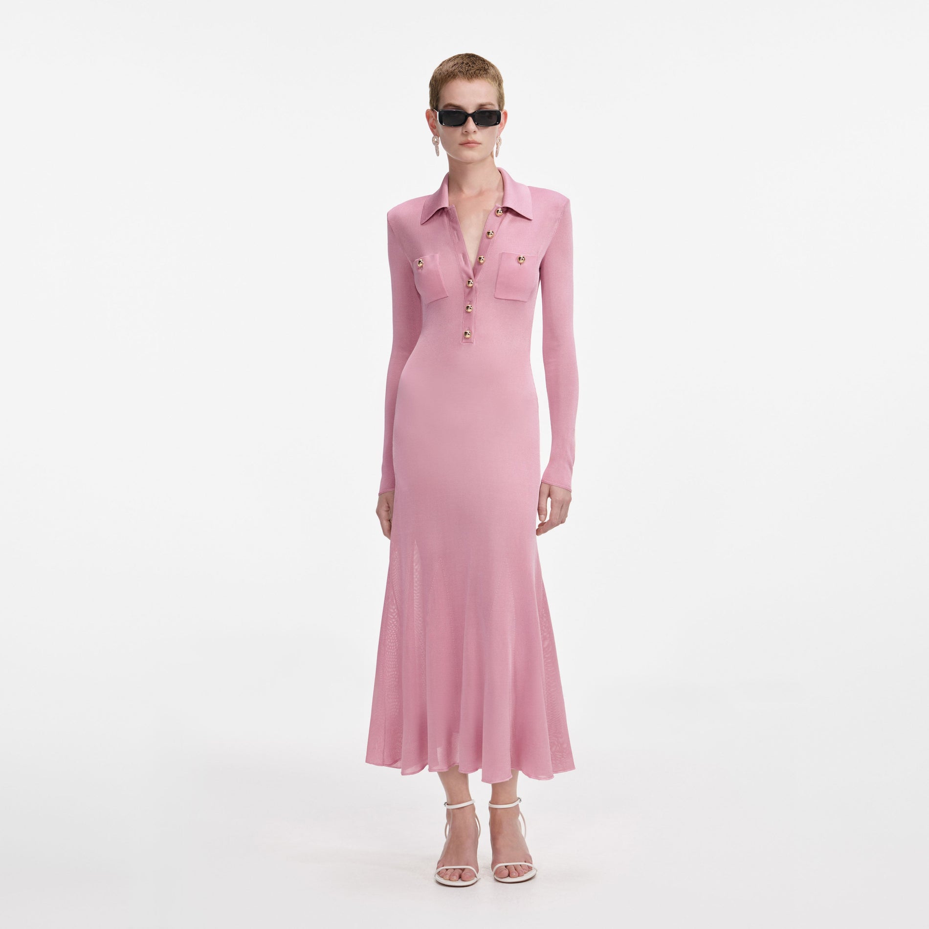 Front view of a woman wearing the Pink Viscose Knit Midi Dress