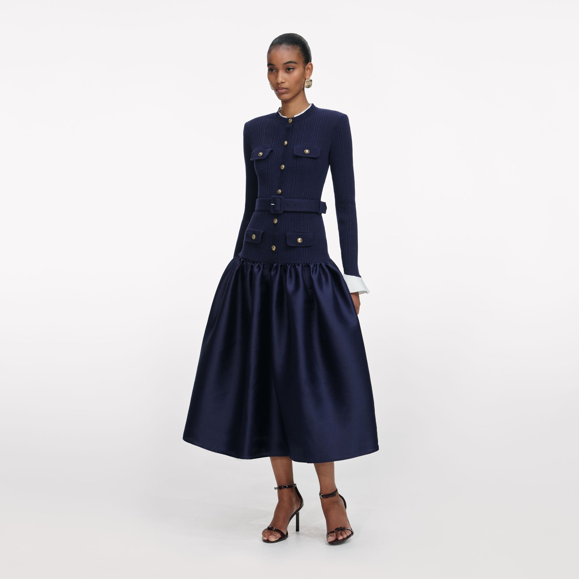 Side view of a woman wearing the Navy Knit Taffeta Midi Dress