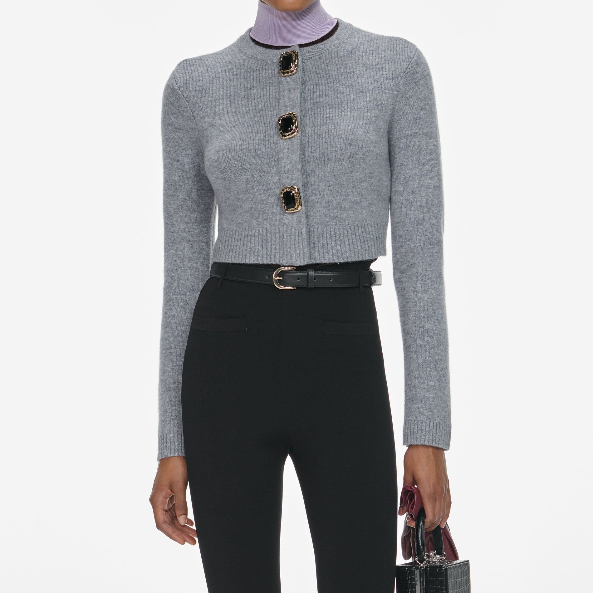 A close up of a woman wearing the Grey Wool Cardigan