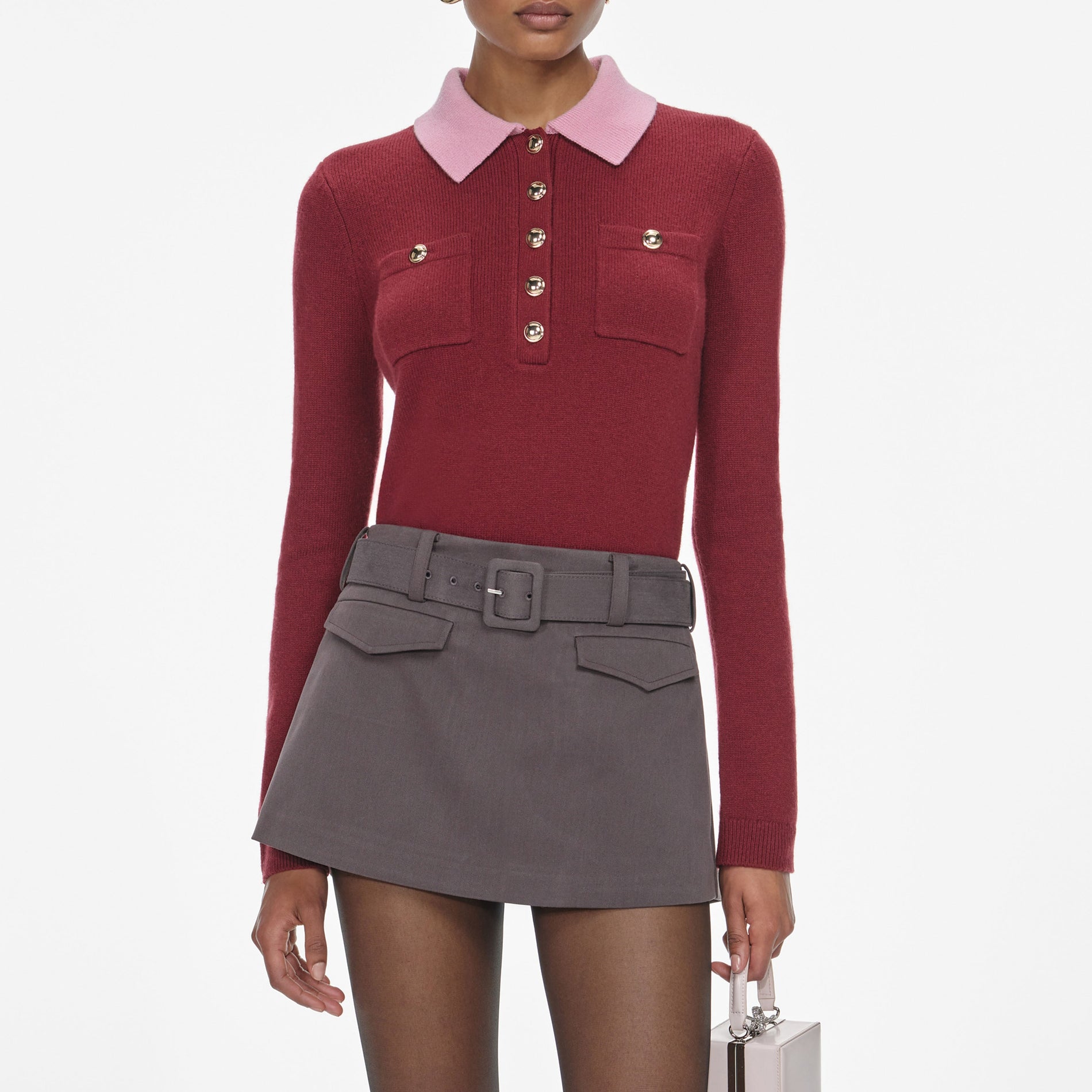 A close up of a woman wearing the Burgundy Pink Contrast Collar Knit Top