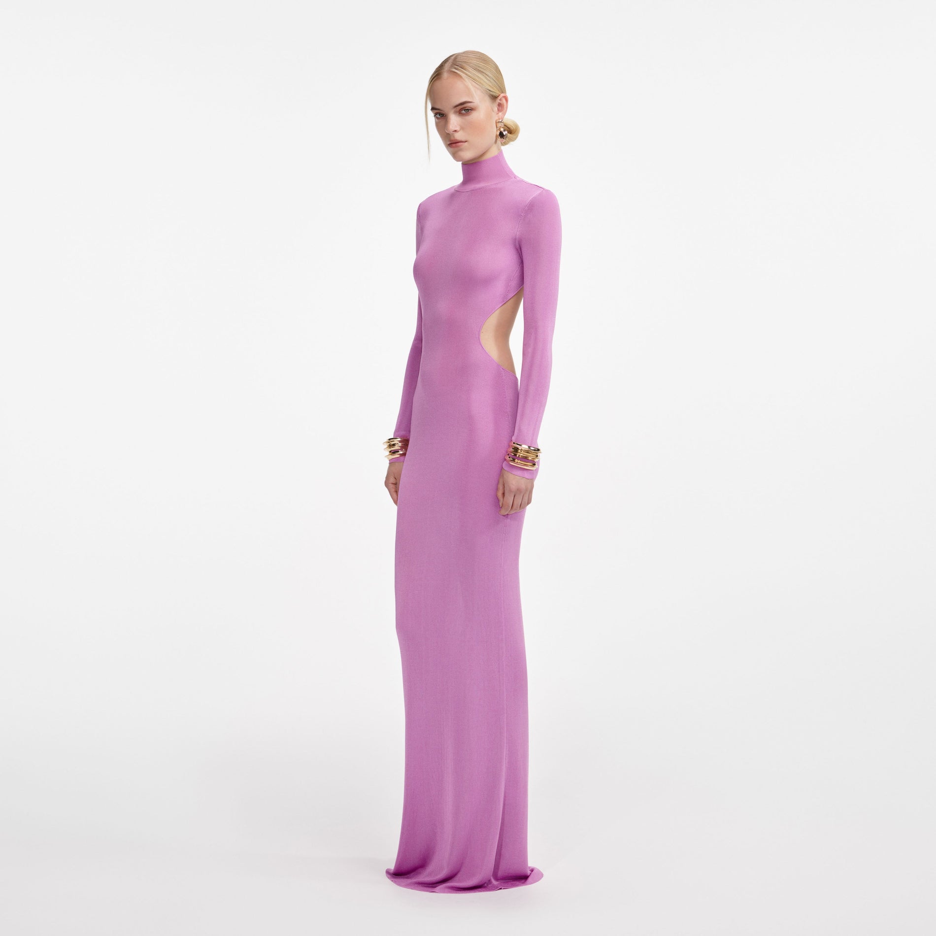 Side view of a woman wearing the Pink Viscose Knit Maxi Dress