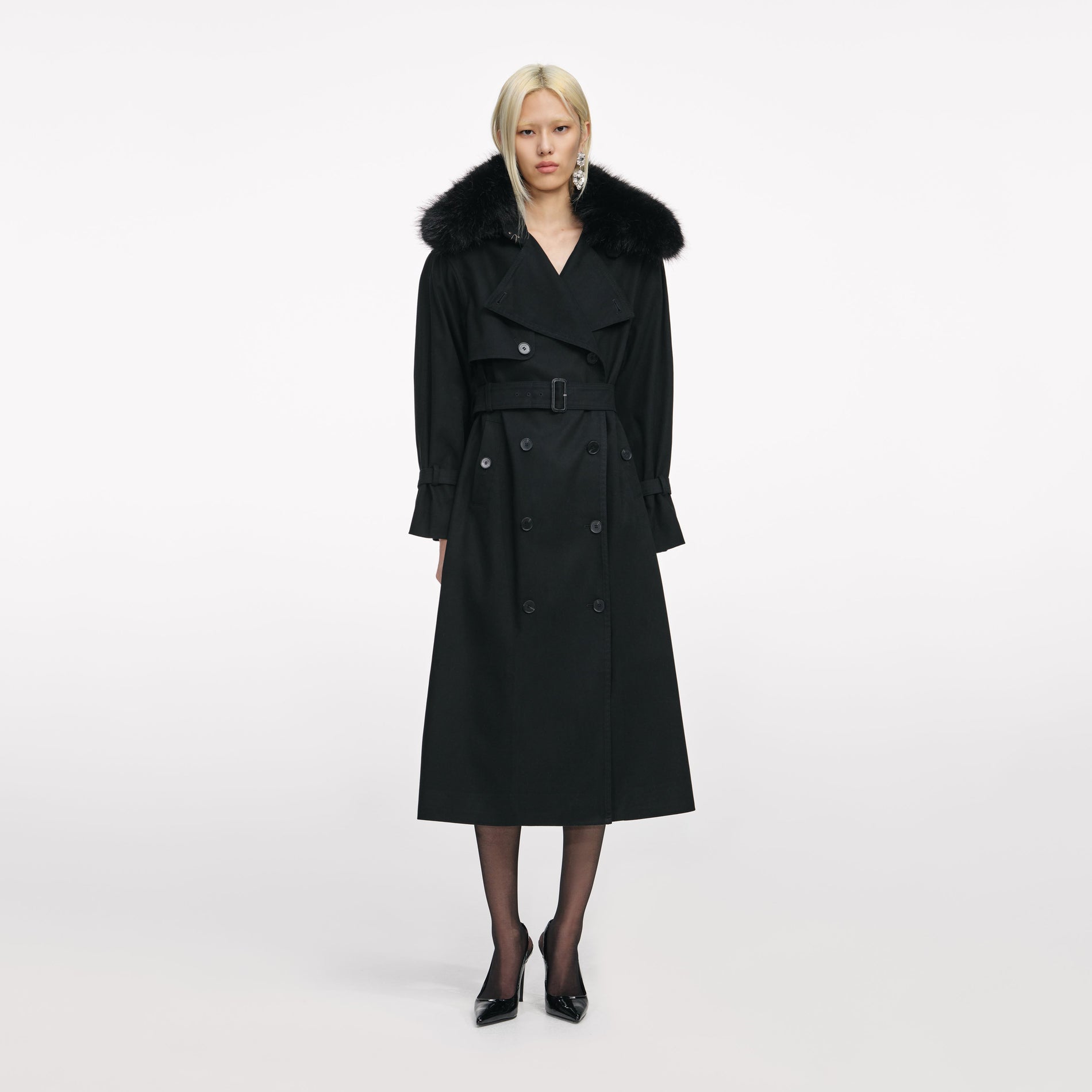 Front view of a woman wearing the Black Twill Fur Collar Trench Coat