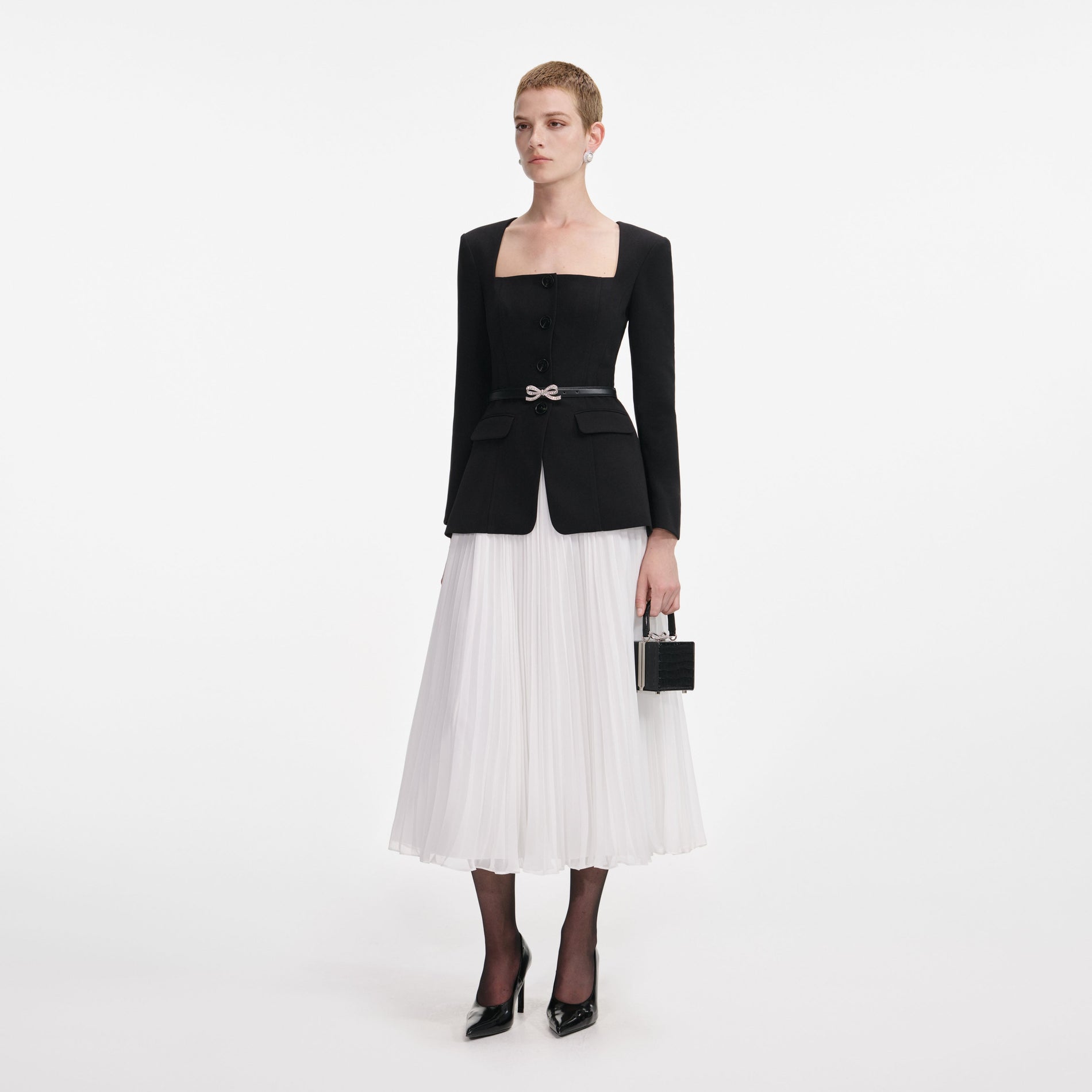 Side view of a woman wearing the Black Long Sleeve Contrast Chiffon Midi Dress