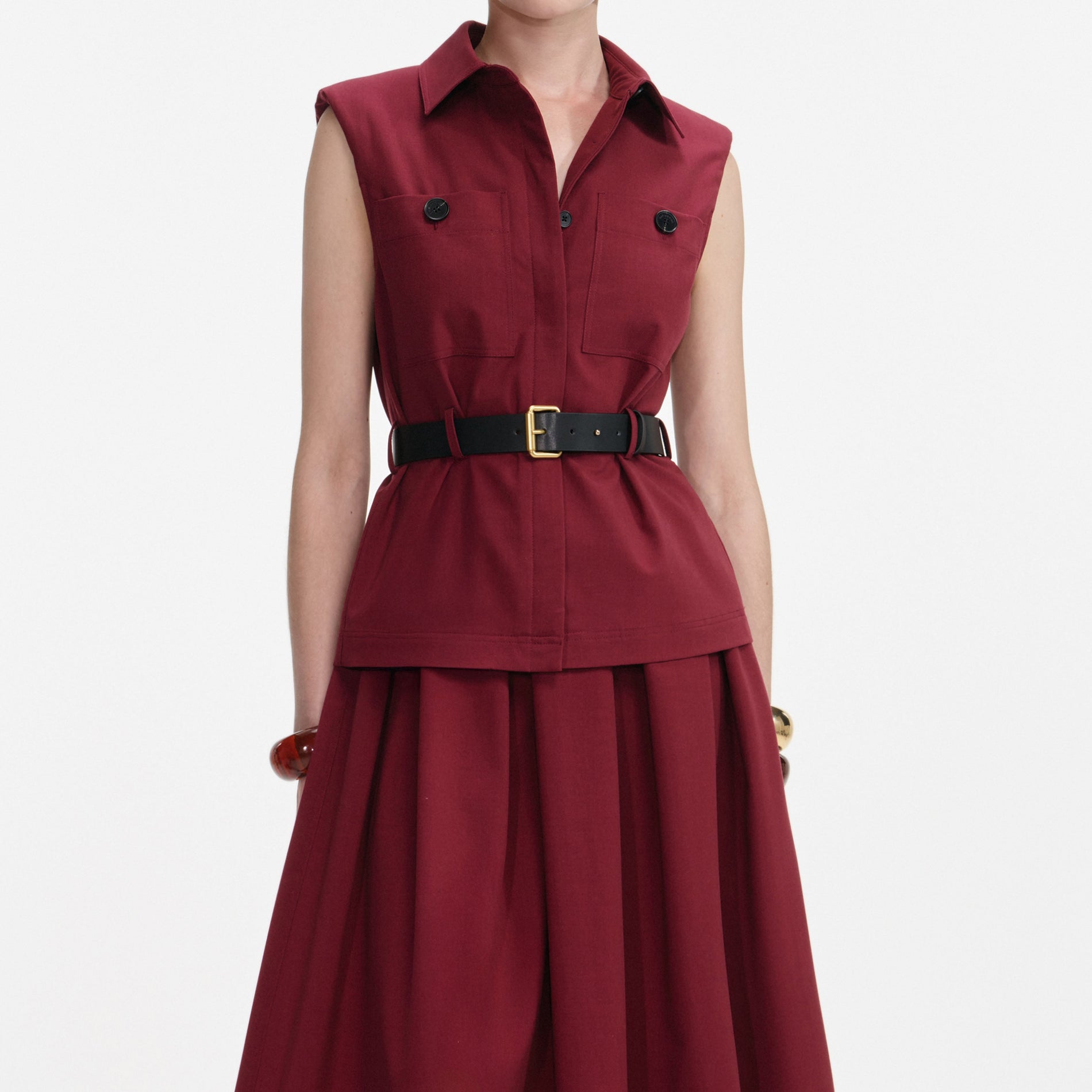 A close up of a woman wearing the Burgundy Twill Belted Midi Dress