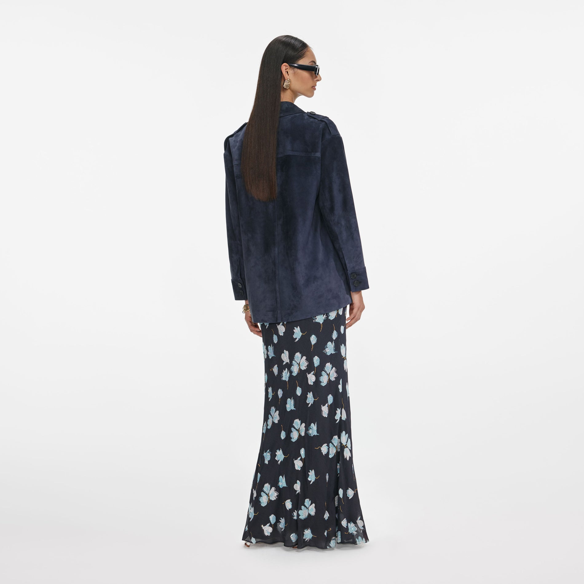 Back view of a woman wearing the Navy Suede Oversized Jacket