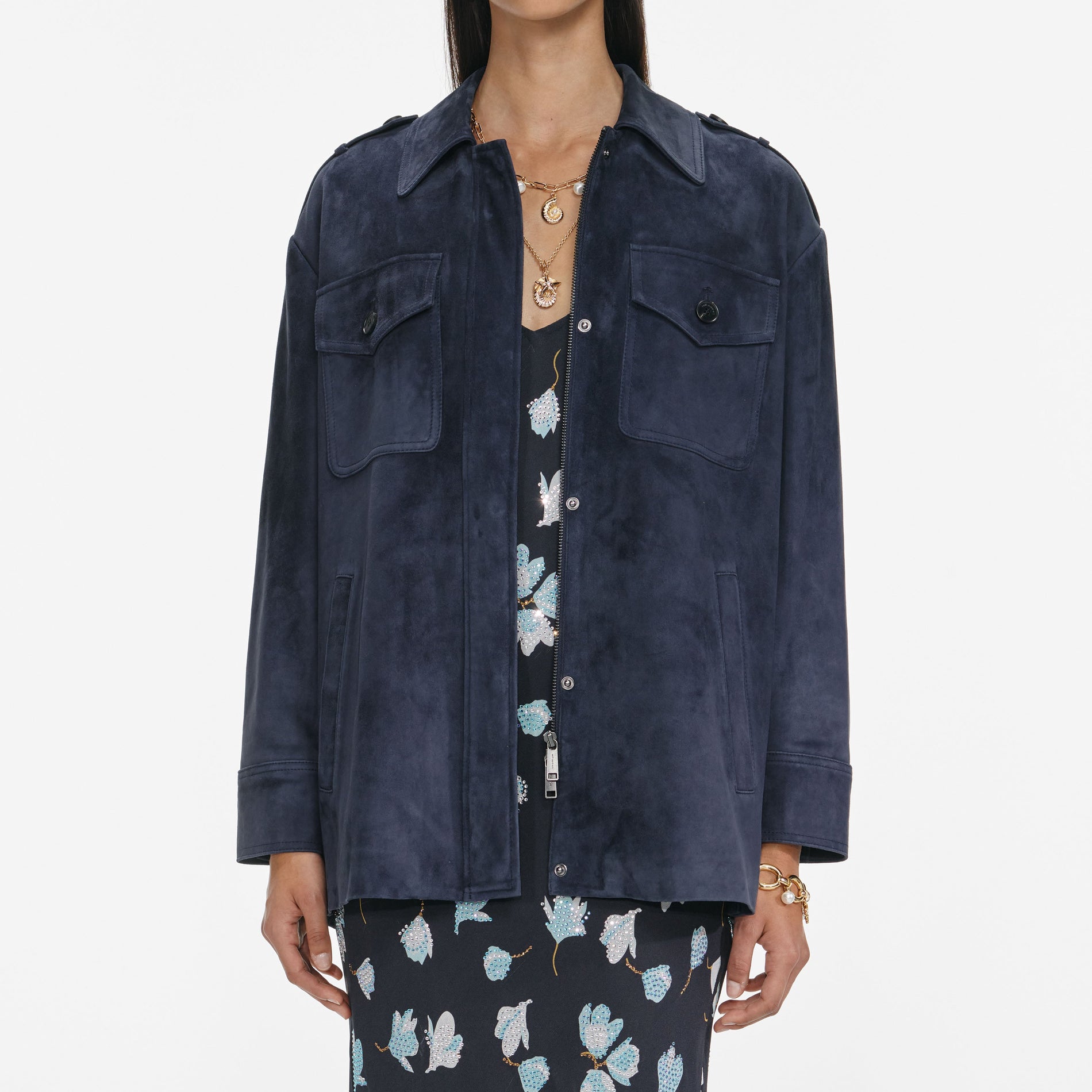 A close up of a woman wearing the Navy Suede Oversized Jacket