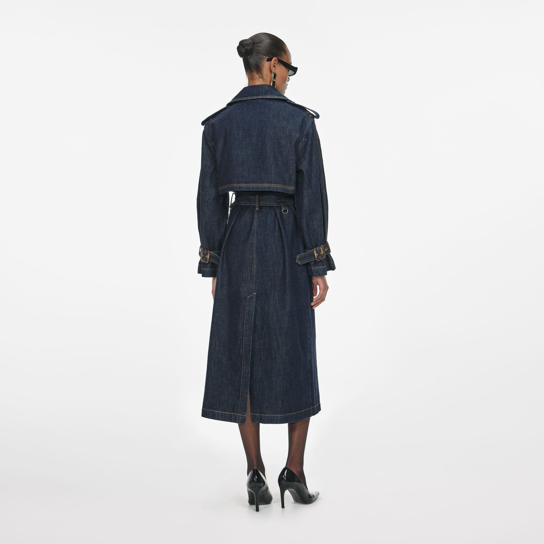 Back view of a woman wearing the Indigo Denim Trench Coat