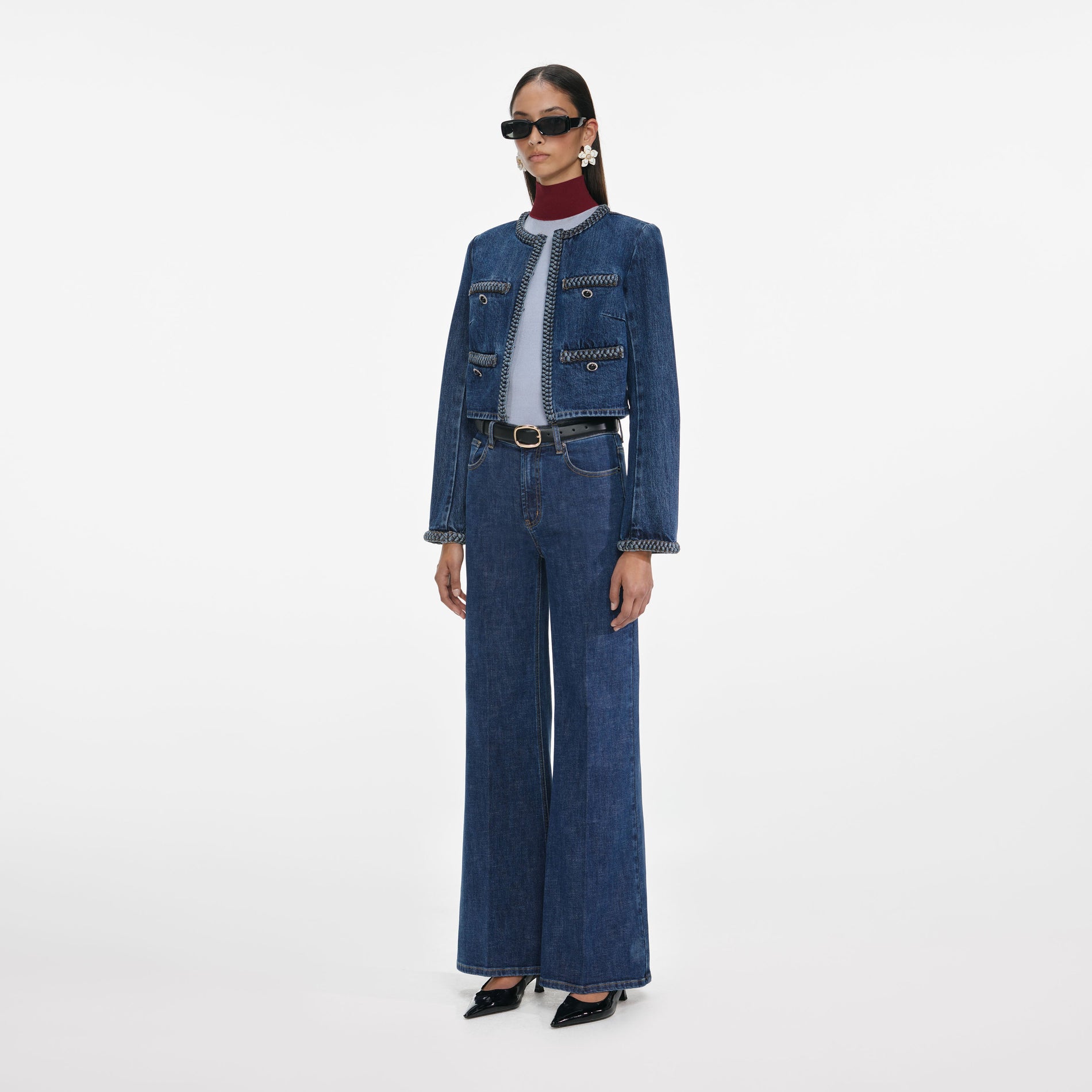 Side view of a woman wearing the Denim Braided Jacket