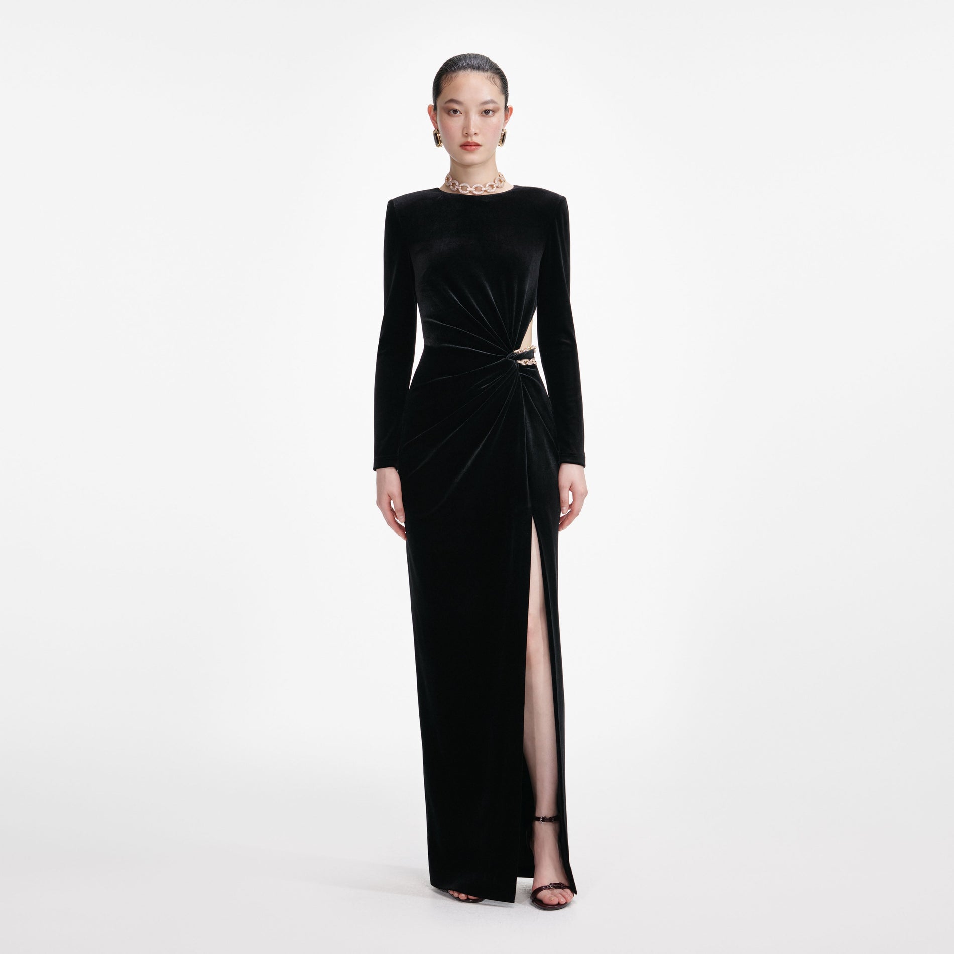 Front view of a woman wearing the Black Velvet Embellished Maxi Dress