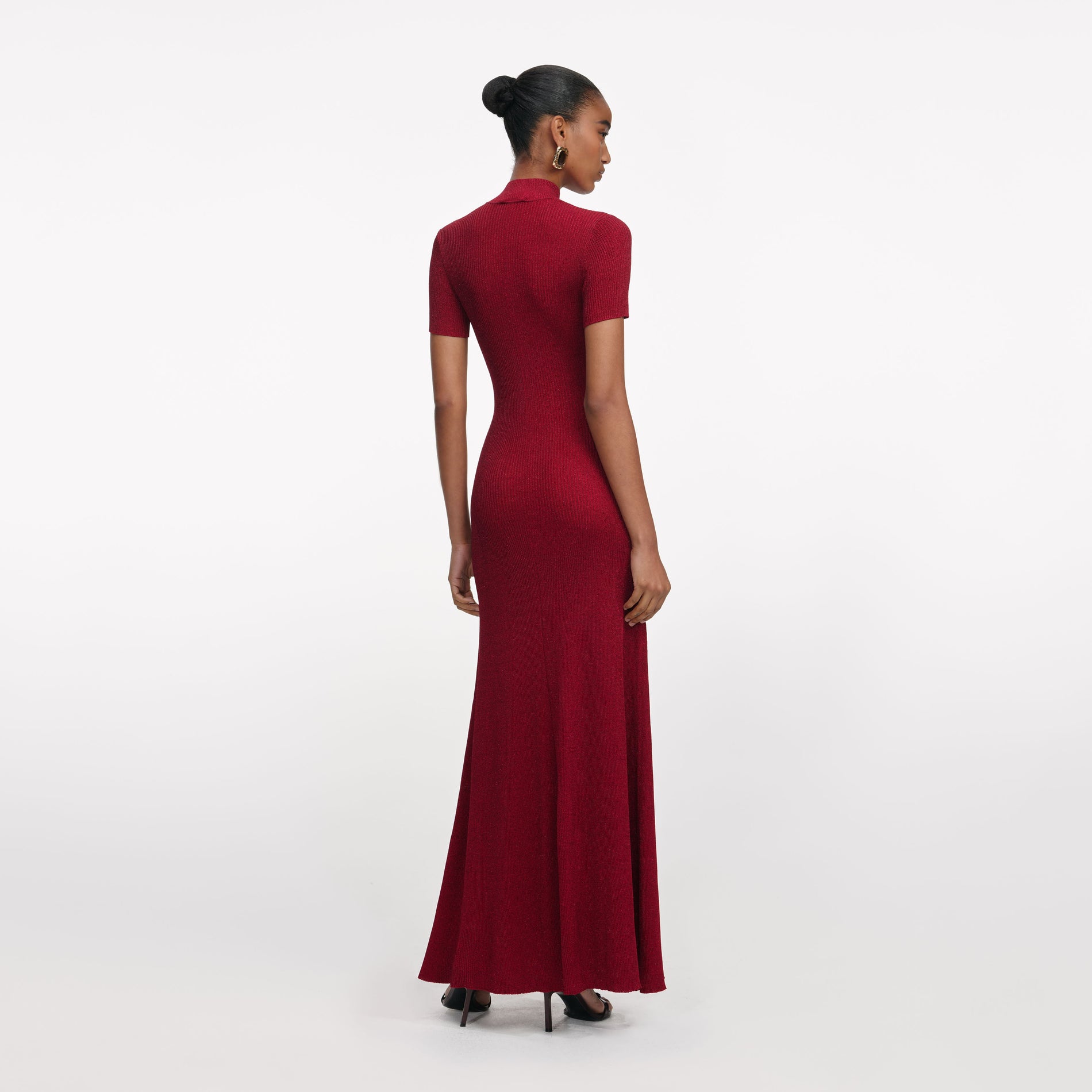Back view of a woman wearing the Red Lurex Knit Maxi Dress
