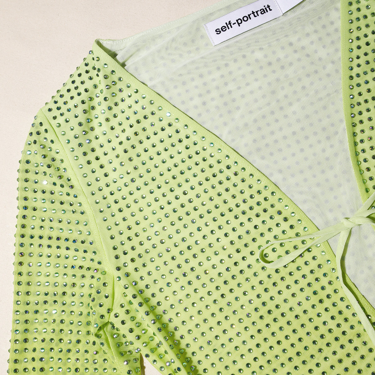 A close up of the fabric for the Green Rhinestone Mesh Keyhole Maxi Dress