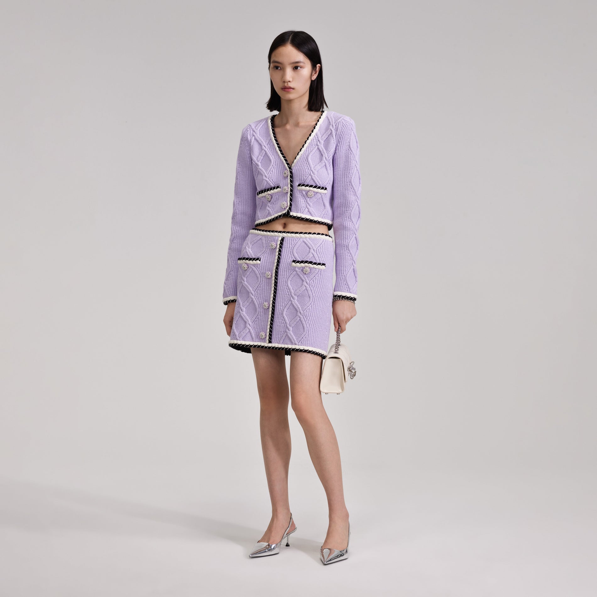 A woman wearing the Lilac Knit Mini Skirt