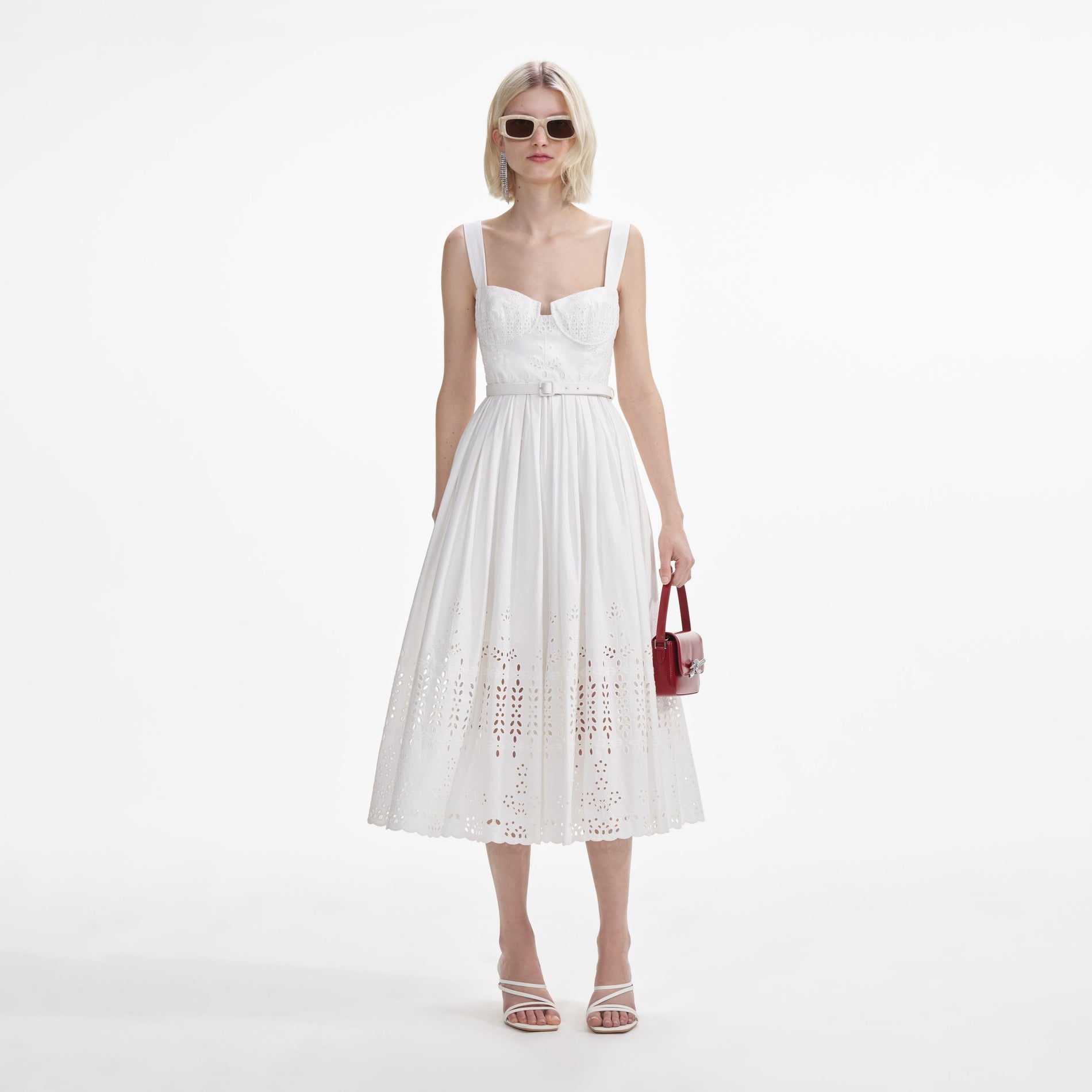 Front view of a woman wearing the White Cotton Broderie Midi Dress