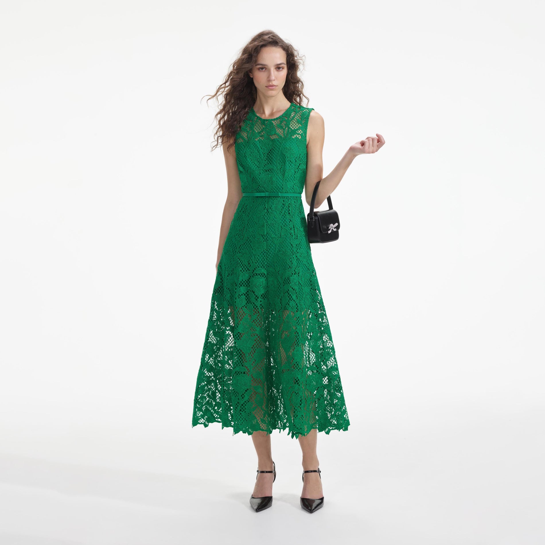 Front view of a woman wearing the Green Lace Sleeveless Midi Dress