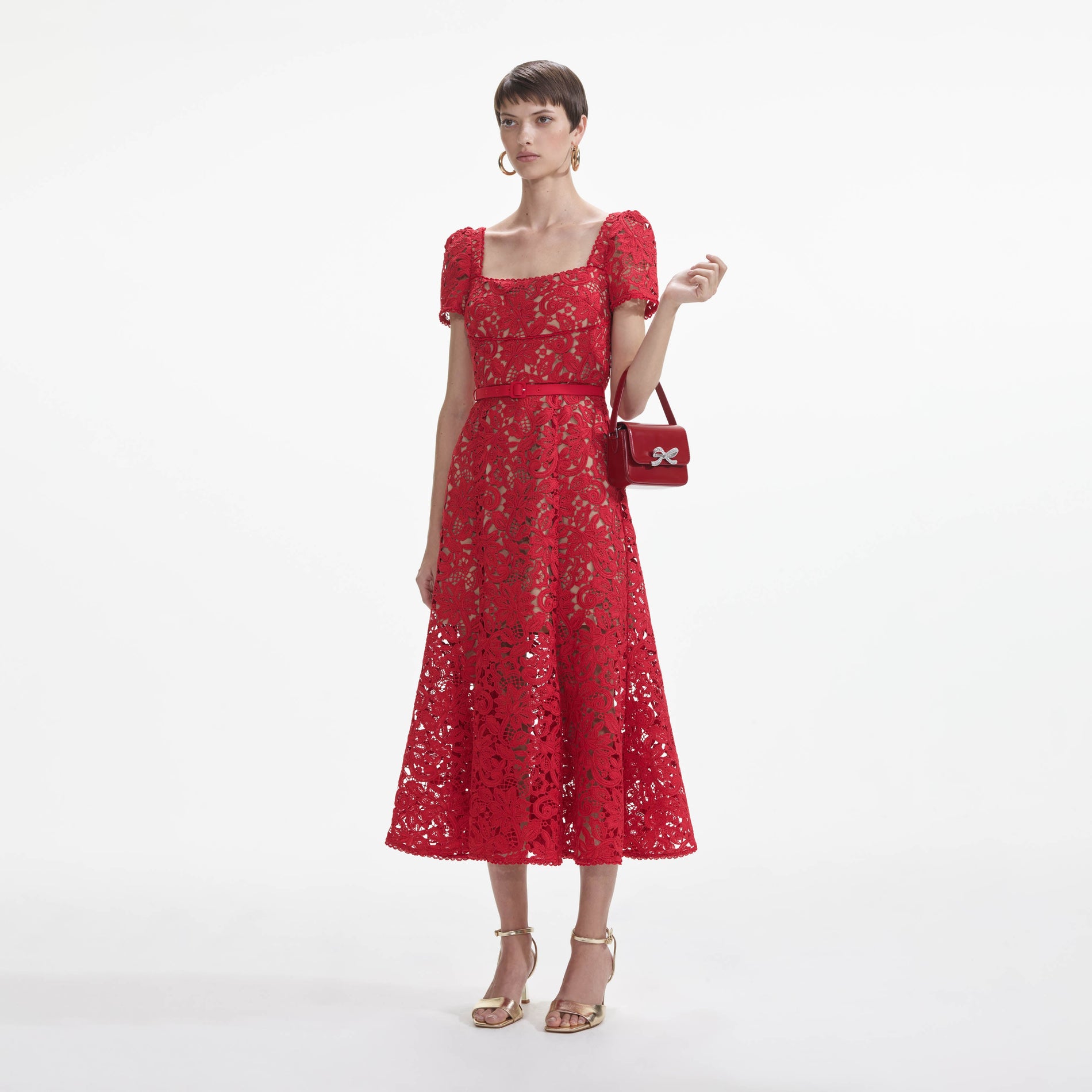 Side view of a woman wearing the Red Floral Lace Midi Dress
