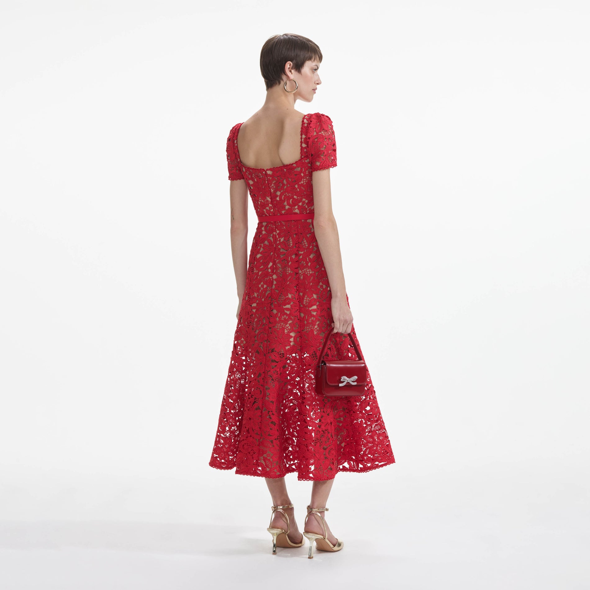 Back view of a woman wearing the Red Floral Lace Midi Dress