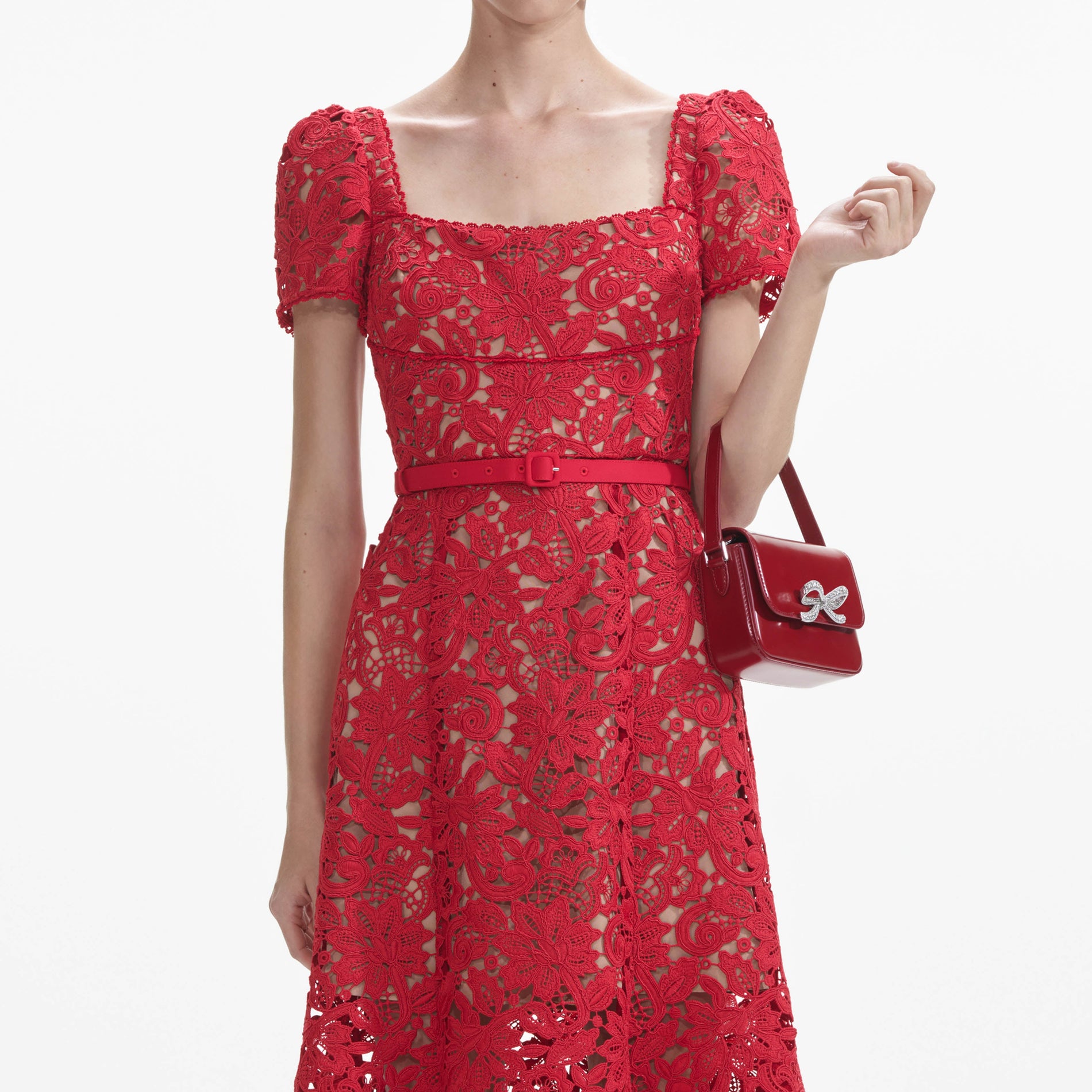 A close up of a woman wearing the Red Floral Lace Midi Dress