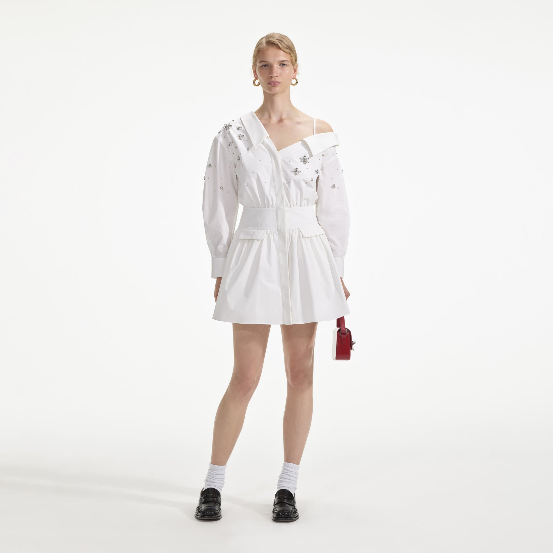 Front view of a woman wearing the White Cotton Embellished Mini Dress