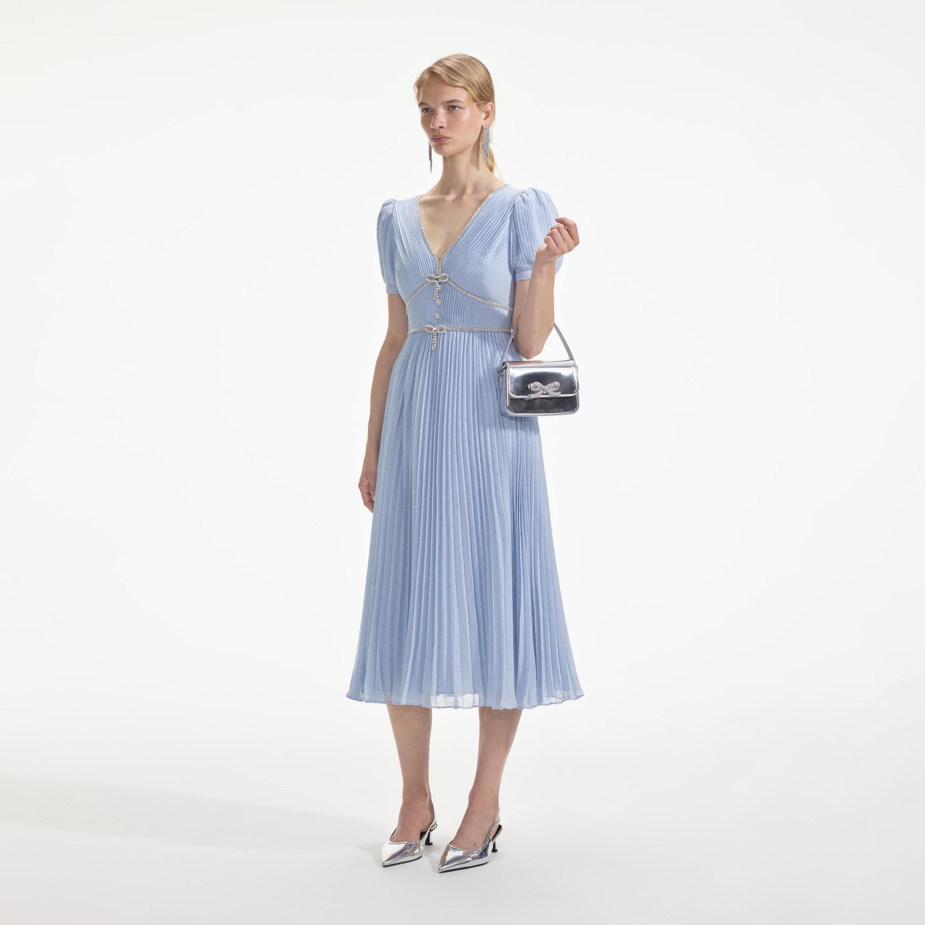 Side view of a woman wearing the Blue Metallic Chiffon Midi Dress