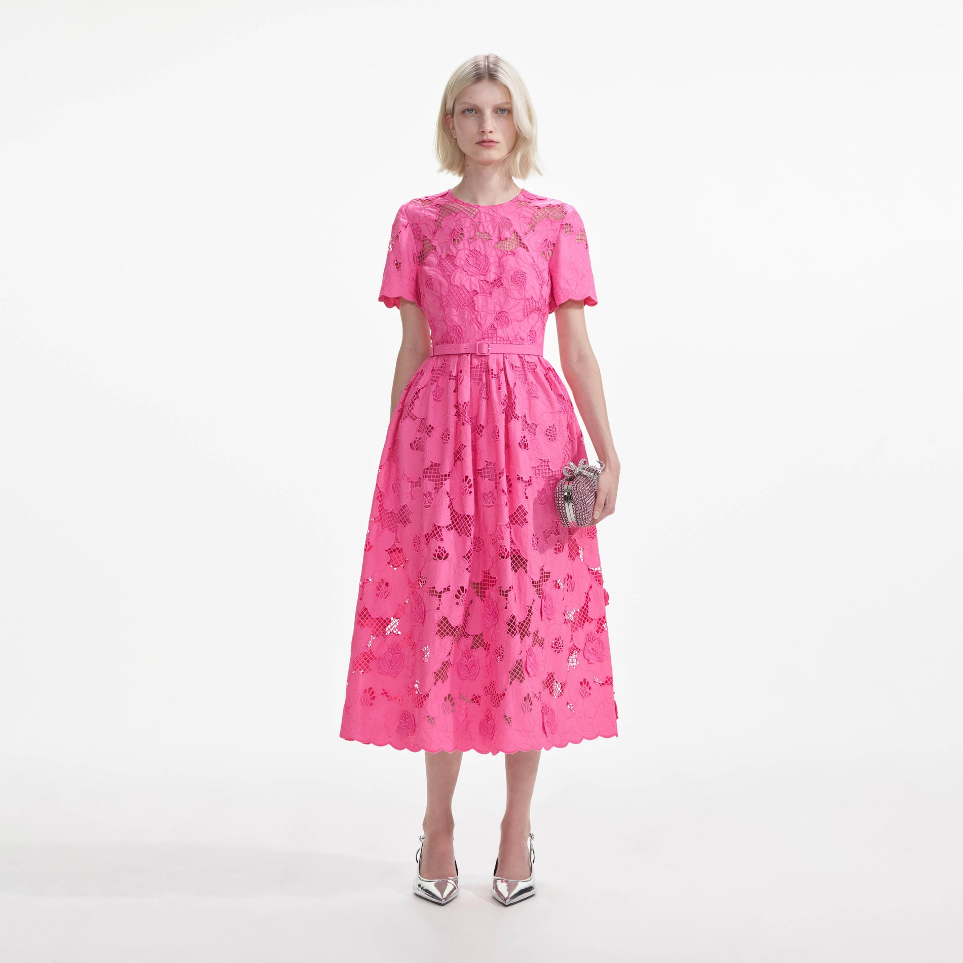 Front view of a woman wearing the Pink Cotton Lace Midi Dress