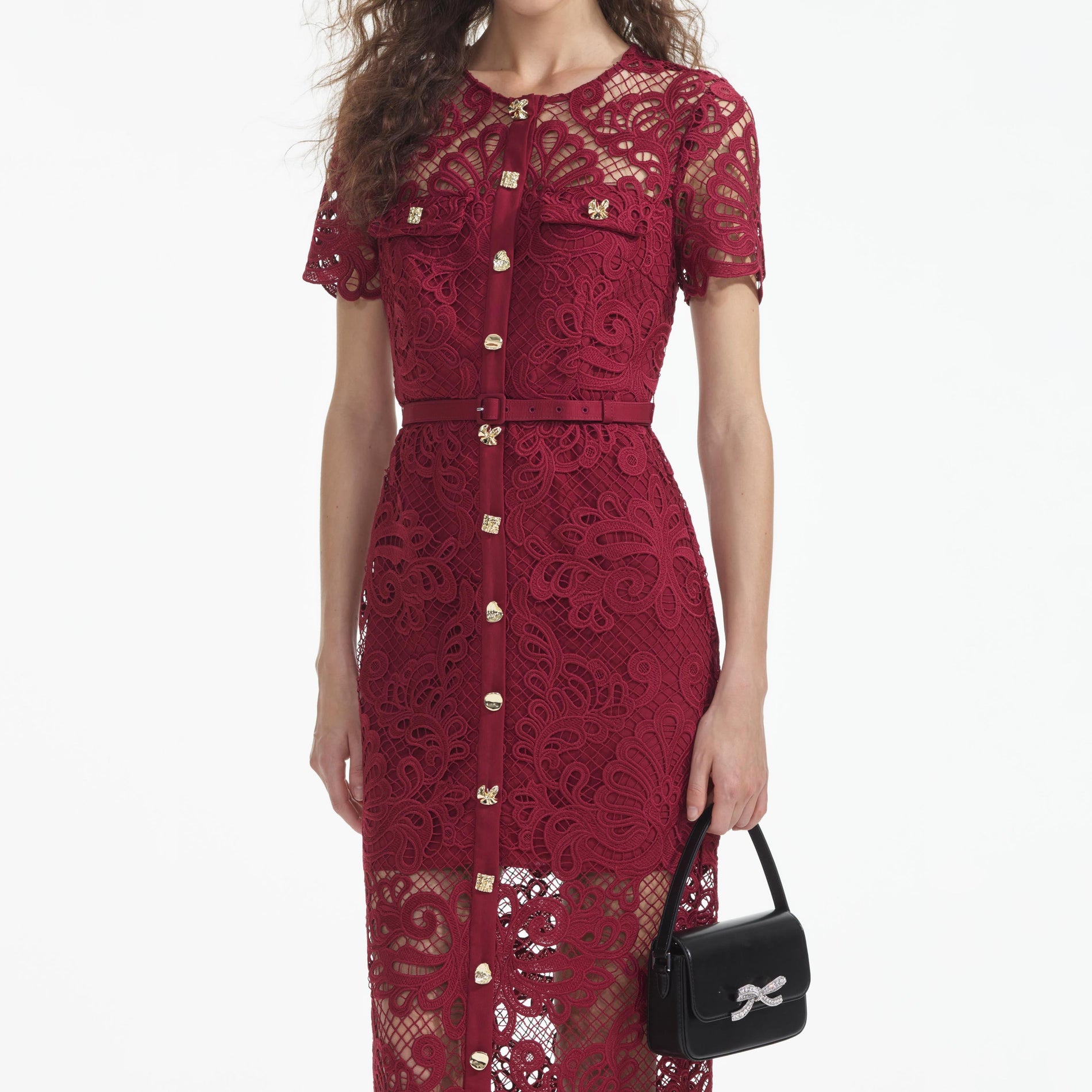 A close up of a woman wearing the Red Guipure Lace Button Midi Dress