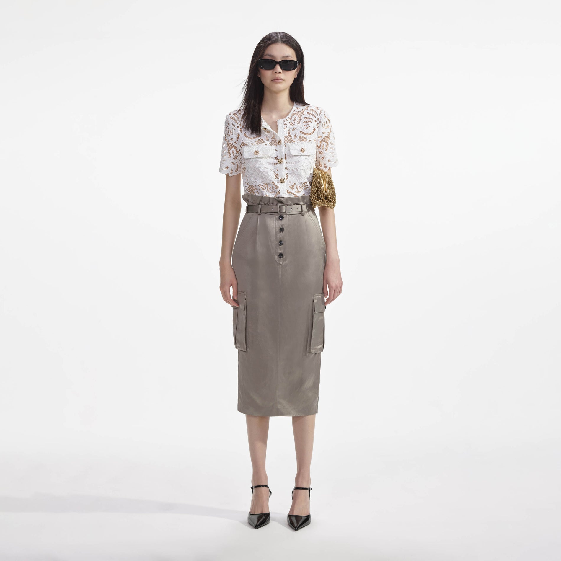 Front view of a woman wearing the Satin Cargo Midi Skirt