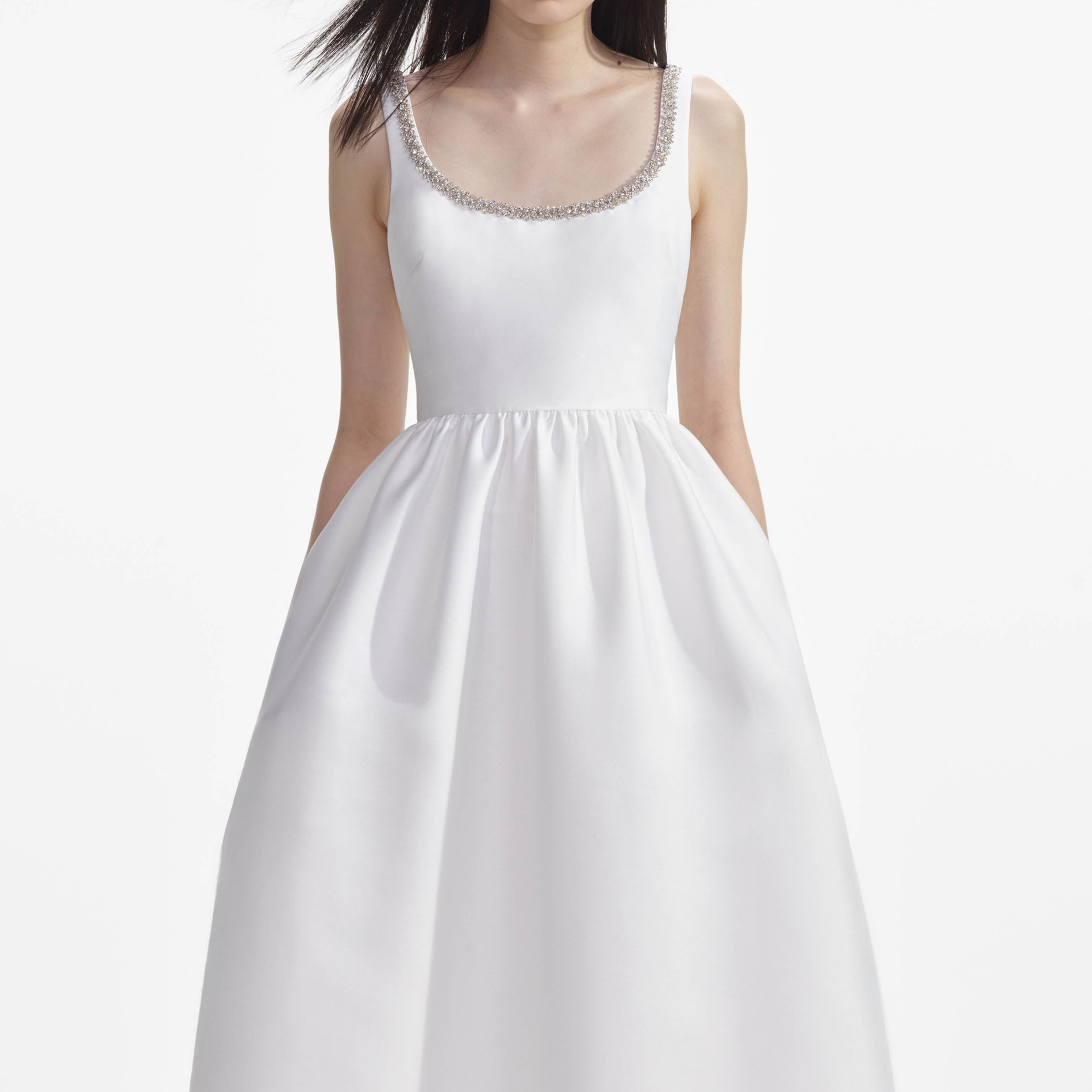 A close up of a woman wearing the White Taffeta Diamante Midi Dress