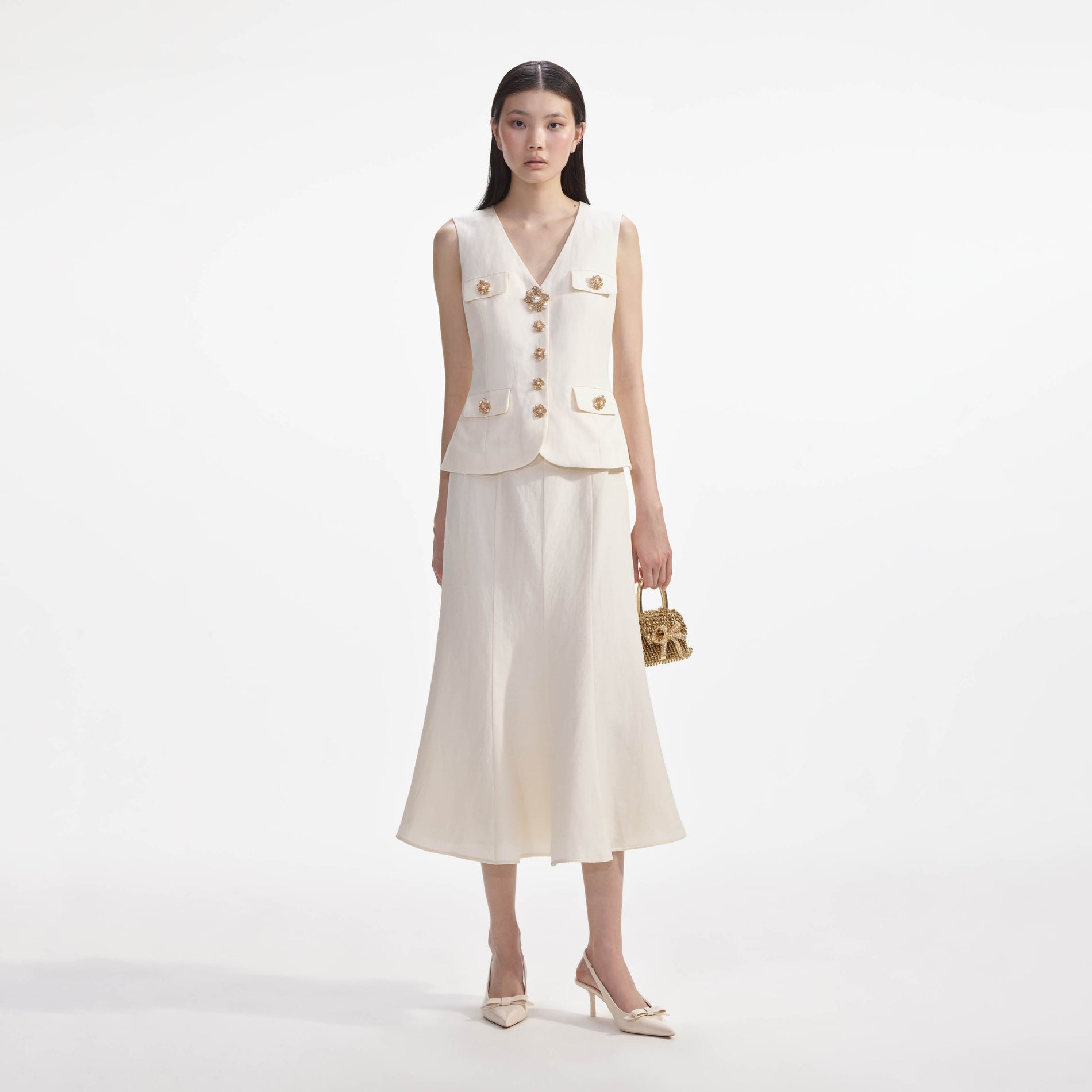 Front view of a woman wearing the Cream Linen Midi Dress